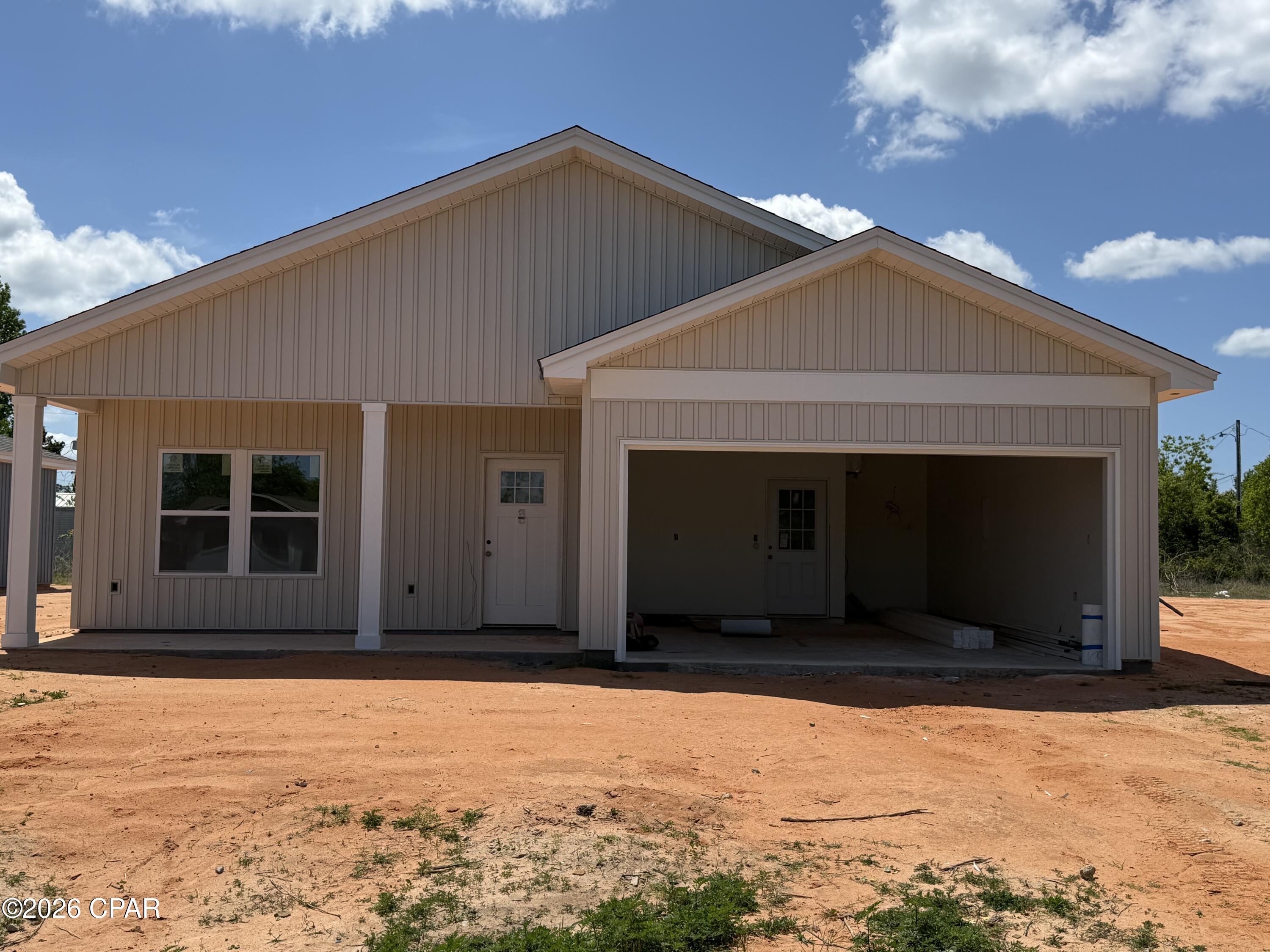 Under construction and nearly ready to impress! This brand-new 3-bedroom, 2-bath home is ideally located in Panama City. Designed with modern living in mind, the home features 9-foot ceilings and luxury vinyl plank flooring throughout, creating a bright and open feel. The open-concept living, dining, and kitchen areas flow effortlessly, making the space ideal for both everyday living and entertaining. The kitchen boasts granite countertops, stainless steel appliances, and a pantry, all overlooking the main living area. Tucked away for privacy, the primary suite offers a peaceful retreat with a double vanity, walk-in shower, and spacious walk-in closet. Two guest bedrooms share a full bath with a tub/shower combination. A convenient mudroom with garage access is located just off the kitchen, providing added storage and functionality. Also, FPL is currently installing underground power for Douglas Road and it should be completed this year.  Don't miss the opportunity to own a beautiful new construction home in a desirable location.
