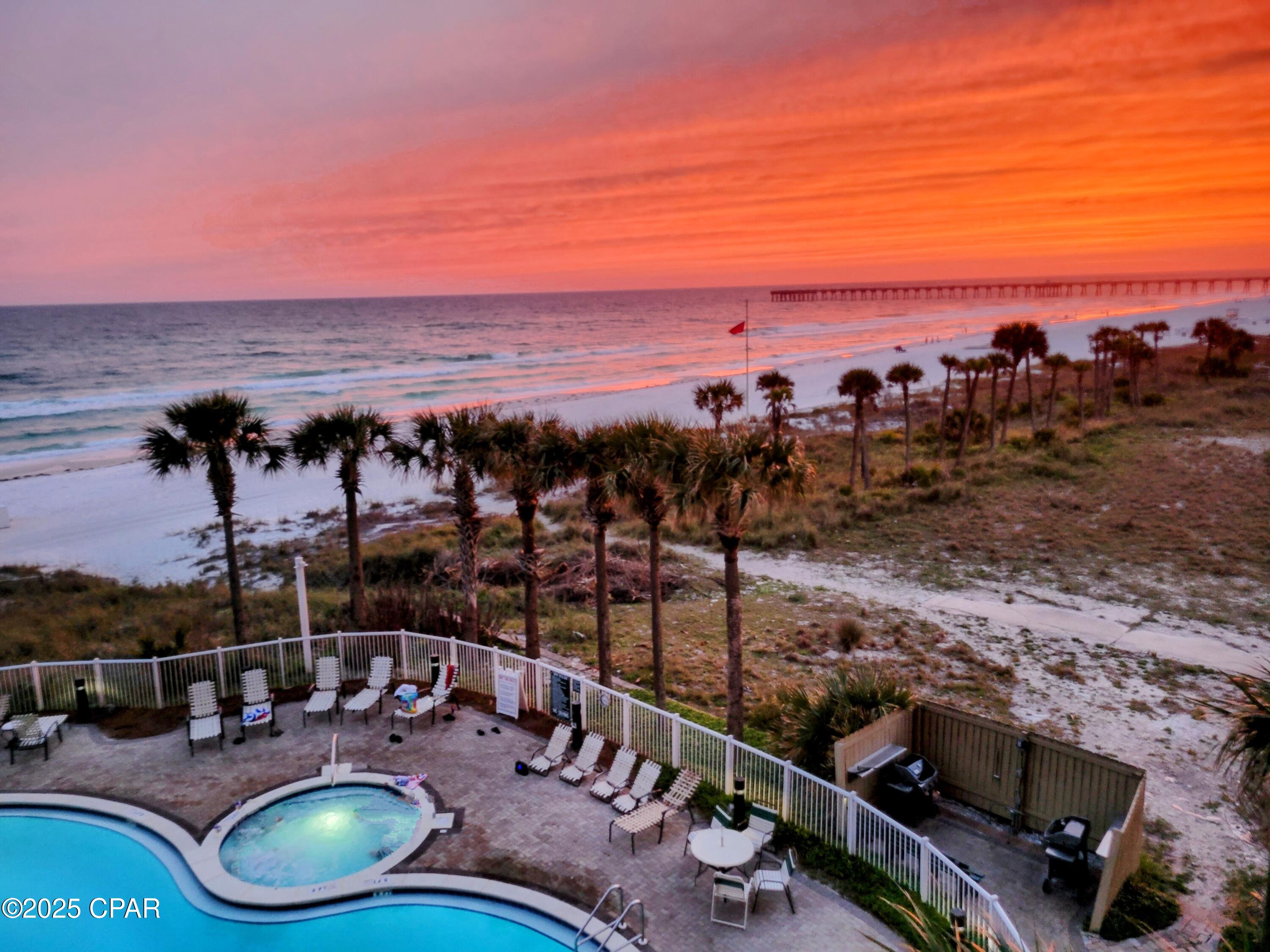 Unobstructed Emerald Coast views drive demand — and this unit delivers. Compared to condos with partial or angled views, full-view beachfront units consistently outperform in rental rates and occupancy. Why pay for half the view when guests are willing to pay more for the real thing? Opportunities like this are rarely available.

This luxury 2-bedroom, 2-bath beachfront condo includes a bonus nook and comfortably sleeps up to 8 with a sleeper sofa, maximizing rental flexibility and revenue potential.

This 4th-floor condo overlooks Grand Panama's beautiful pool and hot tub and has gorgeous views of the emerald waters! Many beachfront condos have a pillar blocking part of the view, but not this one! Listen to the waves while relaxing on the balcony on the upgraded, beautiful poly furniture!

The Gulf front master bedroom boasts a king-size bed with views of the Gulf and has its own private access to the patio balcony. The en suite bathroom includes a soaker garden tub and a gorgeous, totally renovated, tile shower.

You will find a queen size bed with private access to the hall bathroom in the 2nd bedroom. A full-size bed adorns the nook area.

After a long day at the beach, relax in the living room on the unit's sofa sleeper couch or recliner while watching television on the large smart TV.

This resort features a beachfront spa pool, as well as a 2nd rooftop pool deck and spa pool located in Tower 2. Both pools are seasonally heated! Tower 1 pool has an on-site Tiki Bar (seasonally) that serves food and drinks. There are gas grills located by each pool for guest use and the charcoal grills are located on the north side of the 2-story parking garage. The state-of-the-art workout room is located in Tower 2. There is also covered parking and a dog park! The resort is one of only a few resorts in PCB that allow vacation rental guests to bring pets (some restrictions apply)! This is a fabulous competitive advantage for renting!

Grand Panama is just a short walk away from many amazing restaurants. If you want to have some fun with the family, Shipwreck Water Park is right around the corner! You are also within walking distance of the Shoppes at Edgewater which offers many shopping and entertainment options! Pier Park and Frank Brown Park are a convenient drive away.

HVAC 2020. Range 2025. Hot Water Heater 2023. Refrigerator 2023. LG Washer and Dryer Dec. 2022.

Call today and schedule your private showing of this beautiful condo! This is a great opportunity to own a piece of the Emerald Coast and your slice of paradise!