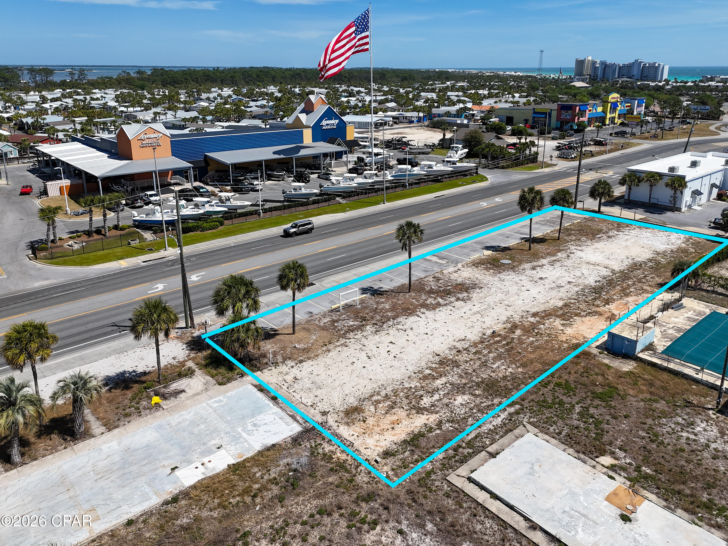 The site features 225 feet of frontage and is zoned C-3, which allows for outside storage and most commercial uses. The property is high and dry, with all utilities already available on-site, including a grinder station.

This location offers excellent visibility and traffic, with nearly 20,000 cars passing by daily. Additionally, it is situated across from two large marinas and in close proximity to St. Andrews State Park.

Please let me know if you would like more information or are interested in discussing this opportunity further. OWNER FINANCING AVAILABLE