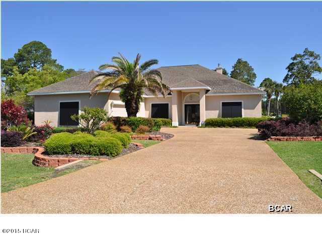 Reduced $50,000.This beautiful home is priced 30% below market!!! Owner is moving!!Bring your offer!! The Glades is one of the most upscale and desired Communities near the beach. This home sits on the 2 hole of '' The Bad'' at the Hombre Golf Club. Screen Covered pool with water fall looks and feels like paradise. 10'and 12'ceilings, split- bedroom floor plan. Many upgrades including granite, crown molding's throughout, Executive luxury home only minutes from the Beach. Truly an elegant home lush landscaping. Family room fireplace, security system with cameras, Wont last long call today for showing.