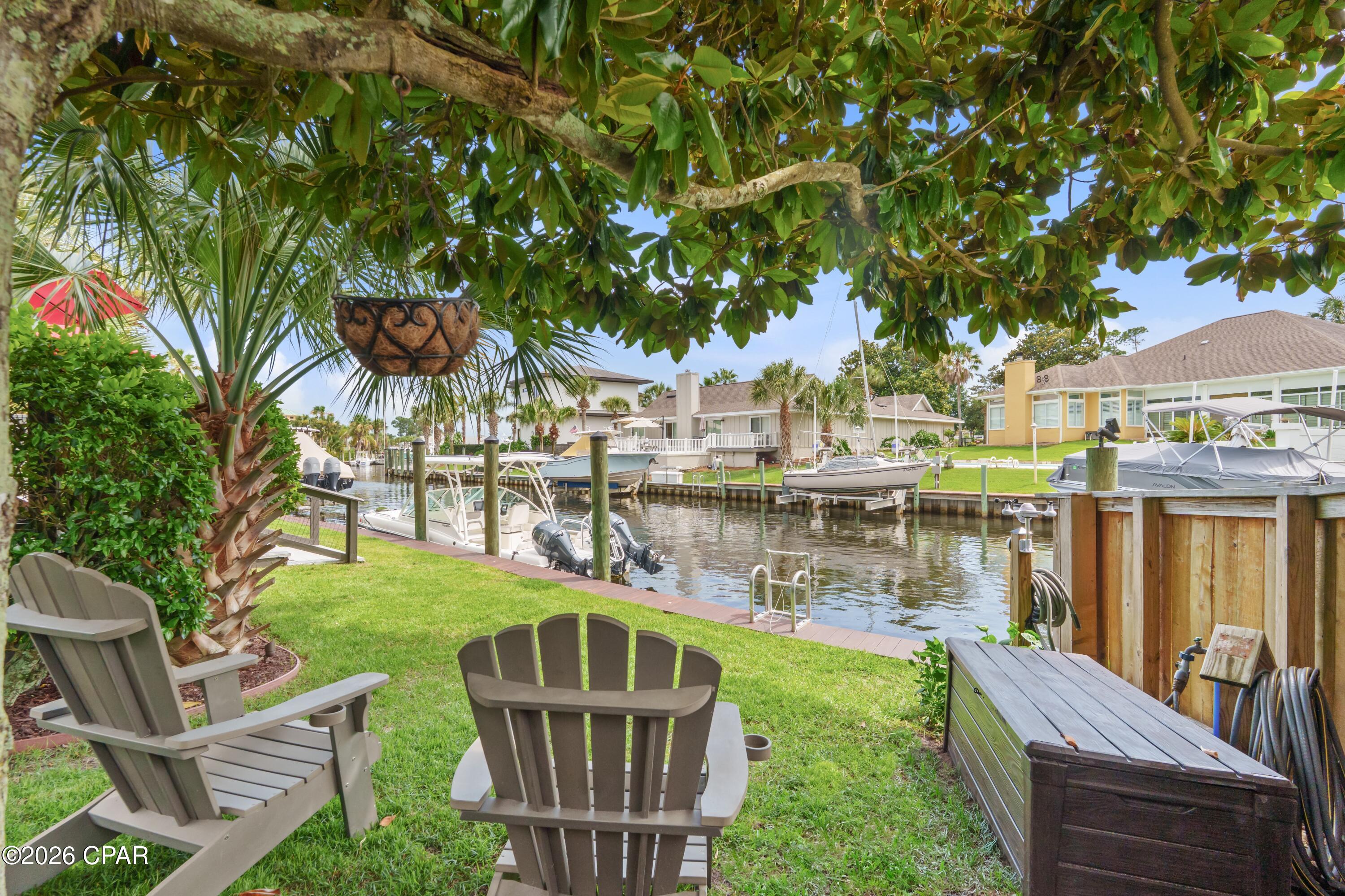 Welcome to 210 Marlin Circle, where coastal living and wellness come together for you to live
the lifestyle you deserve.

Set on a calm canal east of the Bonefish Bridge in Bay Point, this property is re-crafted by a
medical doctor and yoga therapist, offering green to blue spaces, simple Gulf boating access, and restorative design.

Stepping onto the grounds feels like entering a resort, where a bubbling fountain and meticulous zero-scaped paver design with beach pebbles set the tone for relaxation. Entering the house, the soaring cathedral ceiling in the Great Room is anchored by a functional fireplace, creating a warm and inviting centerpiece. Just steps away, the wet bar features a custom granite waterfall
countertop and is equipped with a beverage fridge and automatic ice maker, making it perfect for effortless entertaining.

At the heart of the home is a Chemist-Style Kitchen, illuminated by skylights and framed by
soapstone countertops. This thoughtfully designed workspace includes a touchless faucet, foot-tap to open rubbish cabinet, a combination convection microwave wall oven, and a six-burner gas cooktop with a pot filler. There's even a secret built-in spice rack that adds a delightful element of surprise.
This one-level interior layout home includes four en-suites, one with a curbless shower for
limited mobility, another ideal for children, and the third with a courtyard and private entrance for guests or caretakers. The primary suite has a Turkish-inspired steam shower equipped with
mood lighting/speakers, a soaking tub, and a courtyard featuring a dual-temperature outdoor
shower with a hot tub.

The landscaped backyard serves as your launch for sunrise fishing trips, sunset sailboat
cruises, diving excursions, spontaneous escapes to Shell Island, magical dolphin encounters,
dining at Capt. Anderson's, and refueling at the full service Point South Marina.

Back at your private dock, you're greeted by jumping fish, zoysia grass under your feet, and
watercraft washing stations. There are many chill-out spots on property to choose from,
including a native Southern Magnolia Tree, which provides a natural cooling sanctuary aligned with western facing sunsets to connect and unwind from the coastal breeze and lively birdsong.

This property is move-in ready. It offers 70' of bridge-free private dockage, 30amp shore power, space for a boat lift or keep it open for a sailboat . There are dual laundry zones, air purification systems, HVAC serviced semi-annually since its 2020 installation including ductwork, smart thermostats, tankless gas water heaters installed in 2020 & serviced annually, intelligent irrigation, surround sound, surveillance, automated landscape lighting, dock lights and so much more.

210 Marlin Circle is where wellness meets wonder, and living becomes art.

Schedule your showing today.