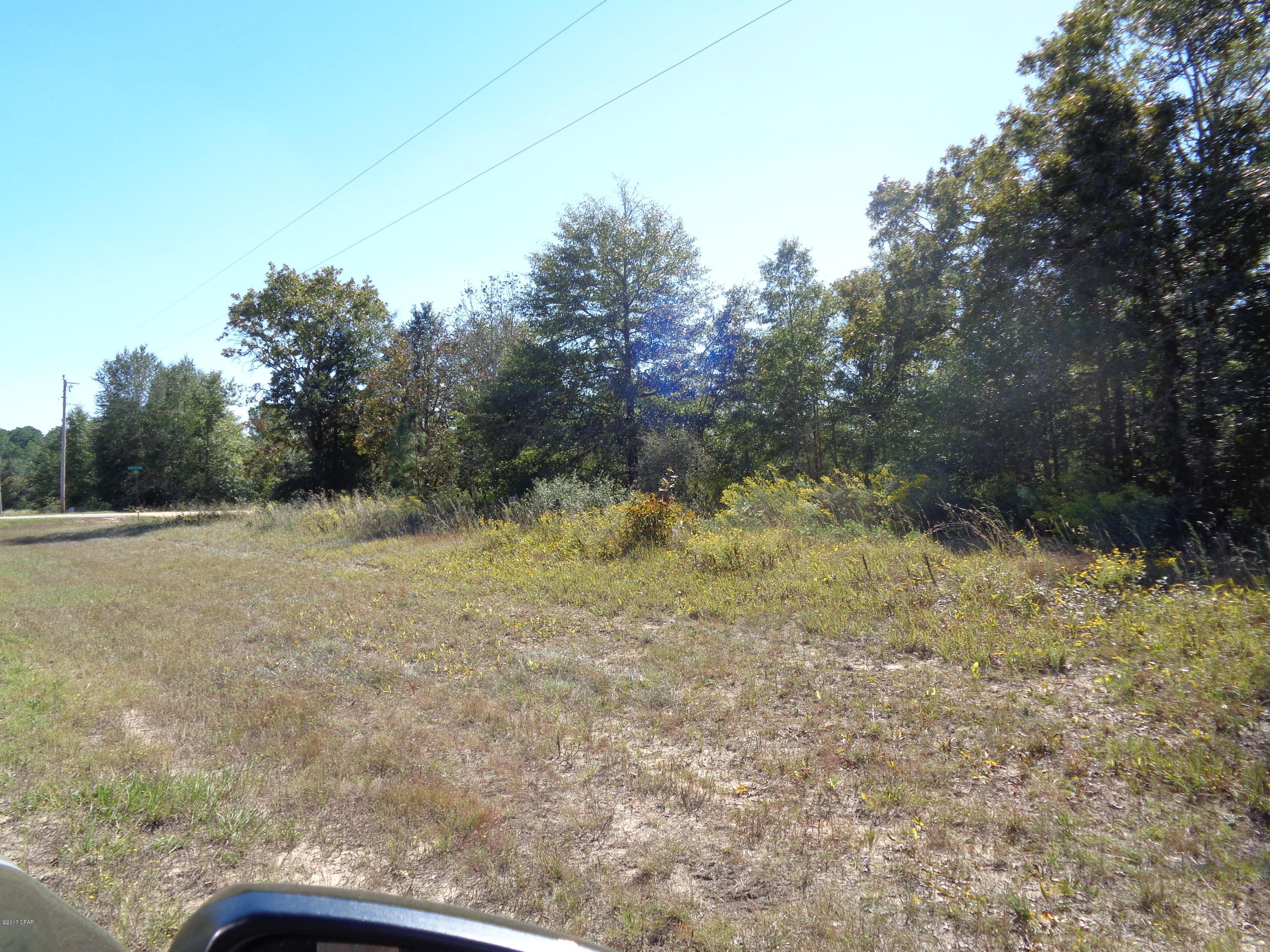 THIS IS A GREAT PLACE TO BUILD A HOME. LOCATED ON PAVED ROAD WITH ALL THE AMMENITIES OF COMPASS LAKE IN THE HILLS. LOT IS OVER AN ACRE. CLOSE TO PANAMA CITY OR MARIANNA.ALSO WOULD MAKE A GREAT INVESTMENT.