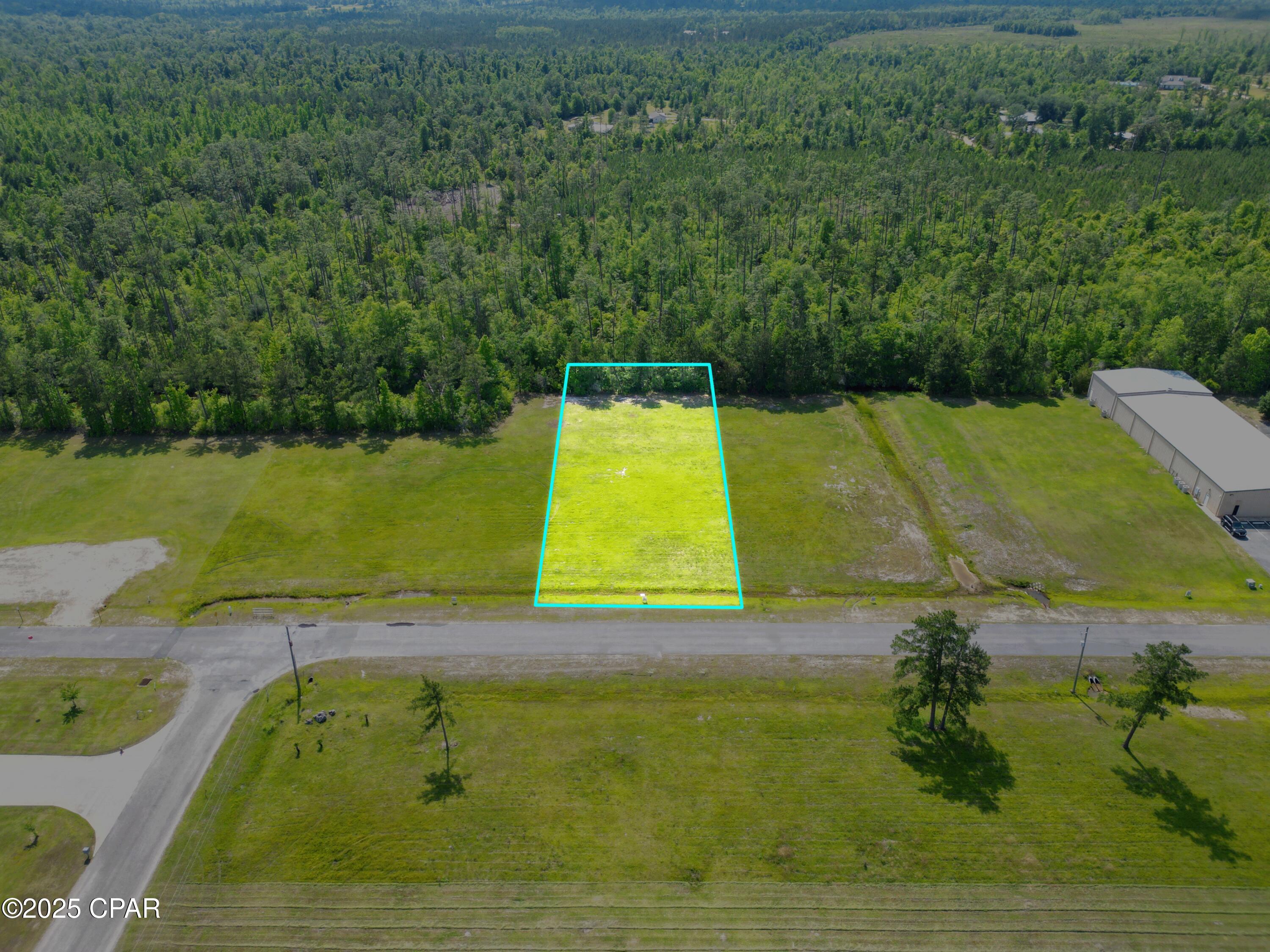 Beautiful high and dry .64 acre commercial lot in college town offering all utilities and high traffic patterns. Accessible via entrance on 2 highly traveled roads: Hwy 90 and Hwy 71.  Located less than 5 minutes from Interstate 10 (Exit 142) and big box stores like Walmart and Lowes.  Very close proximity to recreation: Camping, Spring Creek tubings, and Merritt's Millpond offering boating, kayaking, swimming, cave diving, and world-class fishing.