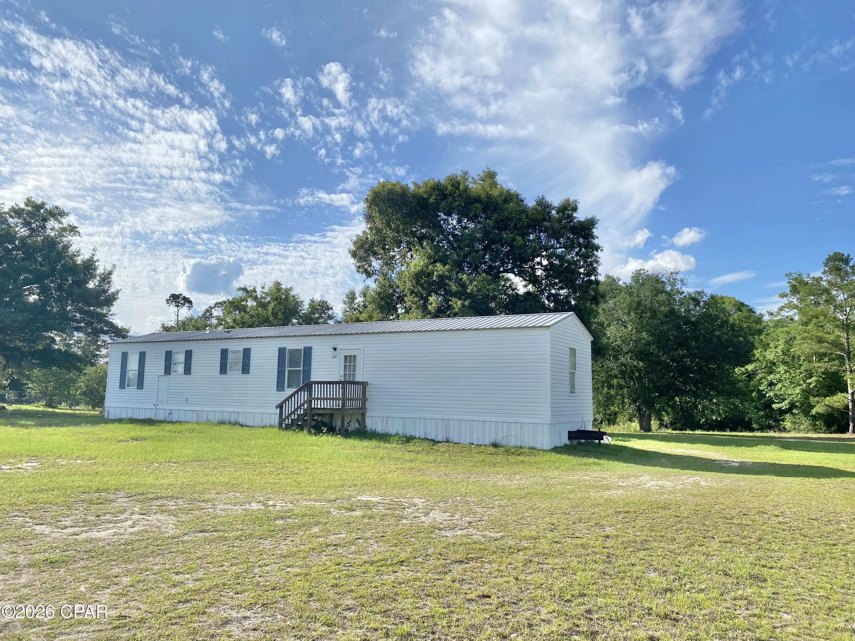 1.36 Acres of great space with a solid 3/1 Mobile home. Metal Roof, Cold AC system, split floor plan in good condition. Possibly add another Mobile or Tiny home. Great getaway or personal residence. Wewa right there and Mexico Beach not too far away. Come see for yourself! Buyer and Buyers agent to verify all dimensions and anything deemed important. Accepting Backup Offers!
Realtor Remarks: Easy show! Vacant on coded loc