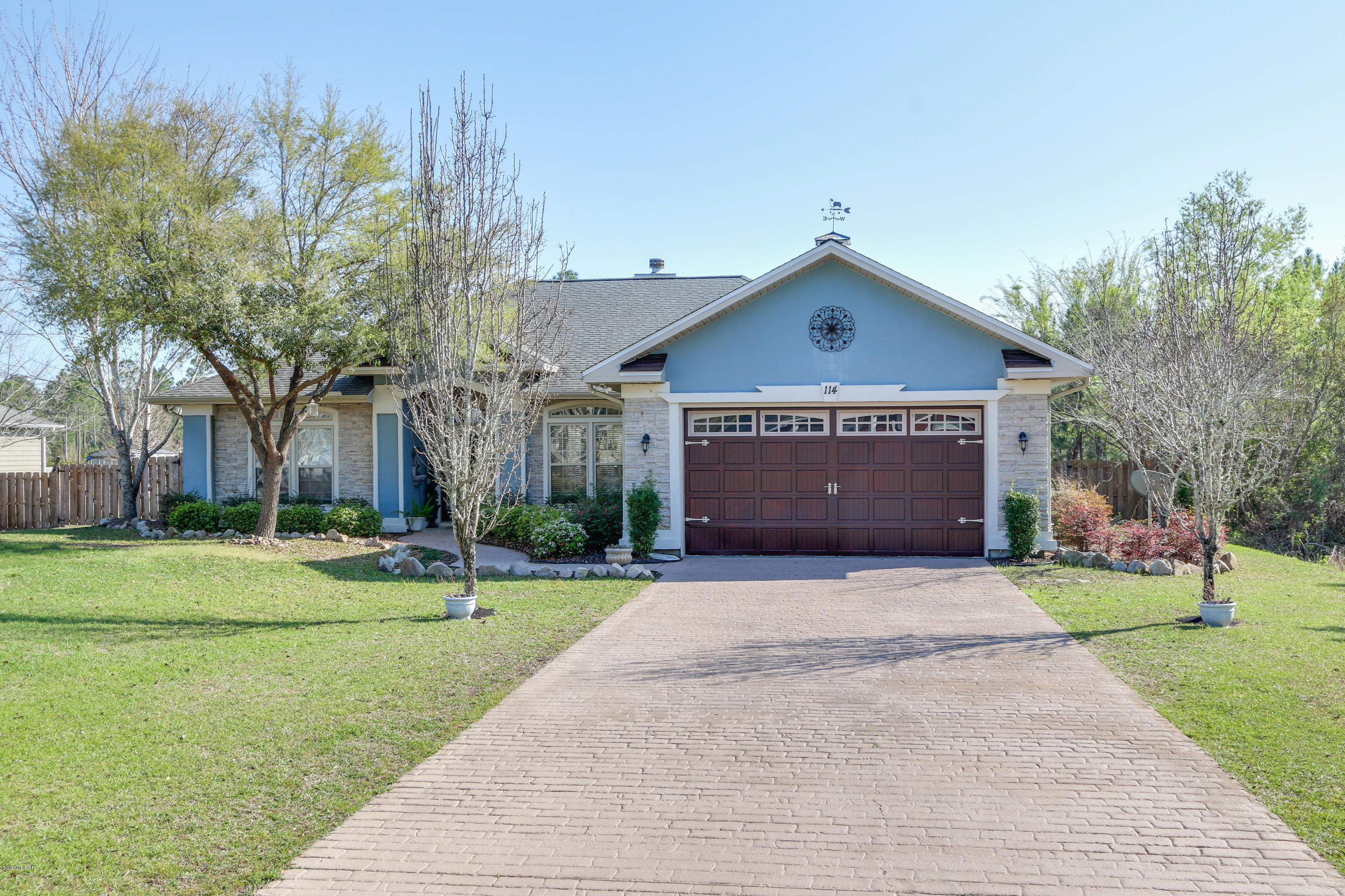 White Oaks subdivision provides country living just north of Southport, FL.  This gorgeous home has been updated with industrial nautical fixtures and colors!  You will love it from the moment you enter the driveway to see the updated stamped concrete and darker garage door with engineered stone on the front of the home.  The living / dining room soars to 16 feet and features a rustic stone fireplace with gas logs.   The kitchen is open to the living room and breakfast area making it ideal for entertaining.  Custom oak cabinets, ubatuba granite and new lighting have updated the kitchen to the latest style.  The appliances are all Maytag and there is a pantry as well! The guest room and master bedroom on the left have also been modernized with tongue in groove accent walls.  Large closets and new travertine tiles complete the modern look in the master bed and bath.  This owner has upgraded and updated virtually every surface of the home and has put in landscaping to provide such a pleasant quiet poolside space in the backyard.   Please call your Realtor today to see this great looking home!  Other features:
Pebble road for RV or boat parking in the back
Backyard completely privacy fenced.
Gunite pool with salt filter so no harsh chlorine needed
Polaris conveys with the sale
Pebble plaster finish on gunite
Septic tank and private well so no water & sewer bills
Culligan Water Softener
Hand scraped hardwood throughout the home except for two guest rooms are hardwood laminate
Poolside is plumbed for a fountain and a sprinkler system keeps the lawn green
Outbuilding makes a great workshop, electric supplied
Average electric bill is $225
Through our preferred lender a 1% buyer credit is available toward buyer closing costs.  100% USDA financing also available to qualified buyers.
Please note - large landscaping rocks in front yard do not convey except with a full price offer.  They have sentimental value.
All details are approximate - if important to buyer please verify.