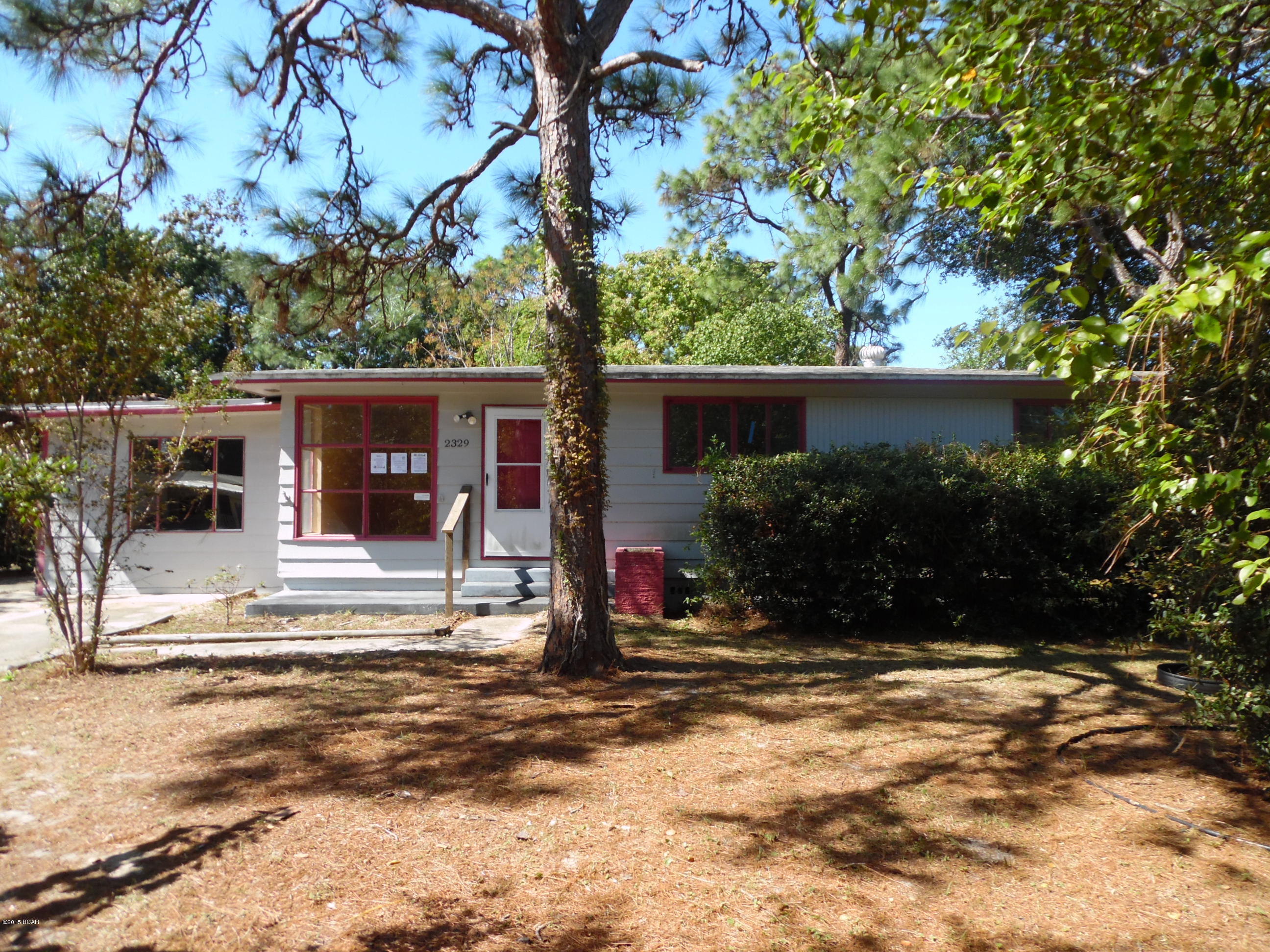 Don't miss this great opportunity to own your very own home, centrally located in Panama City.  This lovely, shaded corner lot is super convenient to all that 23rd St offers, such as restraurants, shopping, hospitals and doctors.  This home has 3 bedrooms, all with the original hardwood flooring, in good condition.  The back yard is partially fenced and would make a great garden area.  The carport has been enclosed for additional living area, complete with a fireplace!   These quaint homes go quick, so contact your favorite Realtor for a showing.  (All info/dimensions/etc is approximate and buyer to verify anything that is important.)