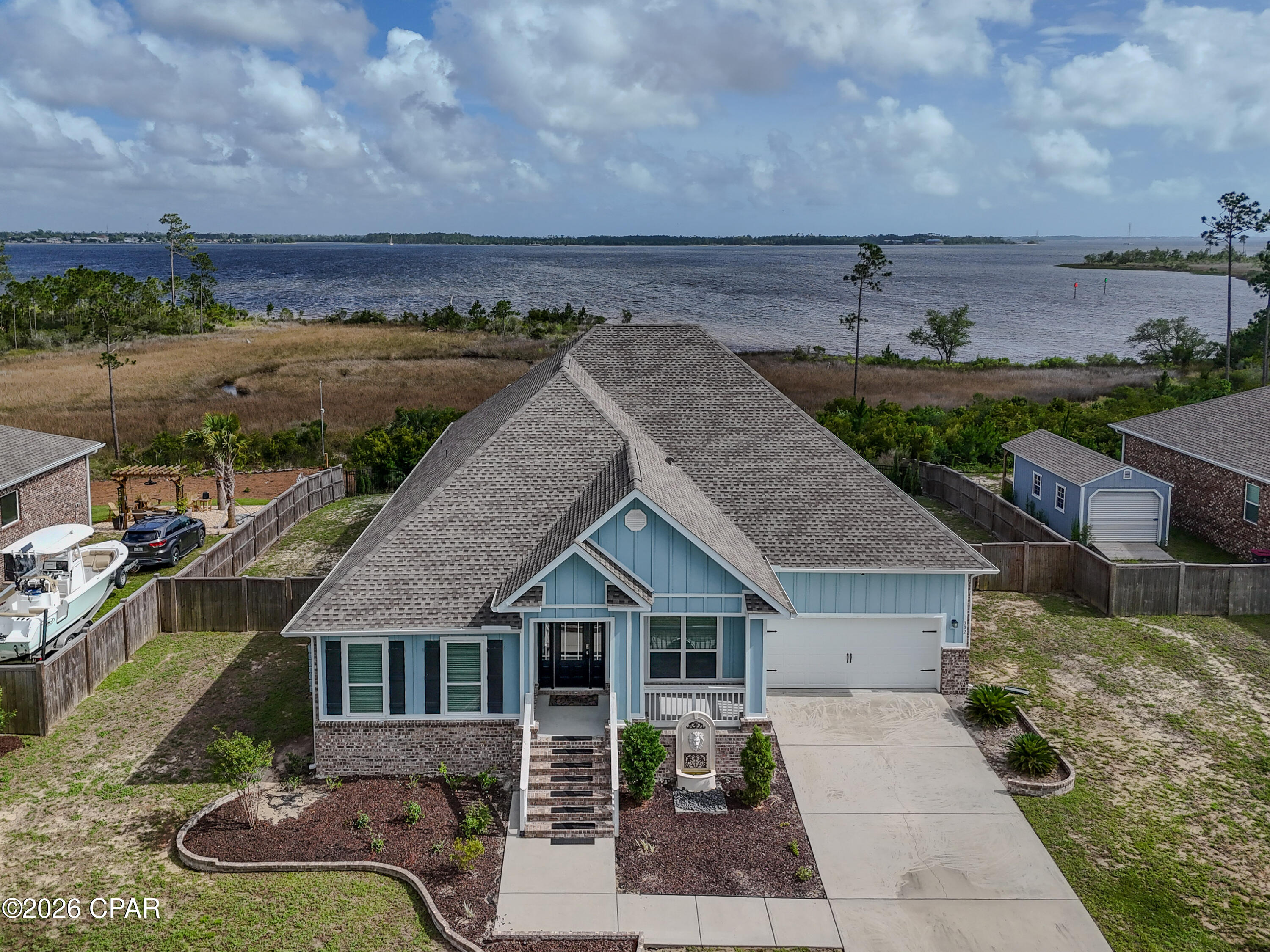 Wake up to breathtaking water views and direct Gulf access from this incredible home designed for coastal living at its finest! You'll just need to add a dock to fully enjoy world-class fishing, peaceful morning coffee on the water, and unforgettable sunset views right from your backyard. Inside feels like new and showcases custom lighting in a spacious living room along with a dedicated office/den that is perfect for working from home or extra flex space. The chef-inspired kitchen features a built-in oven, microwave, and cooktop, sleek granite countertops, a breakfast nook, formal dining area, and a massive breakfast bar made for entertaining. You'll love the endless counter space, oversized pantry, and an abundance of crisp white cabinetry that keeps everything bright and organized. The primary suite is a true retreat with stunning water views, a generous layout, huge walk-in closet, soaking tub, separate shower, and double vanity. Each additional bedroom is spacious with large closets, giving everyone room to spread out comfortably. Step outside to your covered patio and fully fenced backyard with a beautiful paver patio that is perfect for grilling, relaxing, and spotting dolphins passing by. When you're ready to leave your private oasis, enjoy resort-style amenities including a community pool, kids' park, and more! Coastal living doesn't get better than​​‌​​​​‌​‌​​​​‌​​‌​​​​‌‌ this.