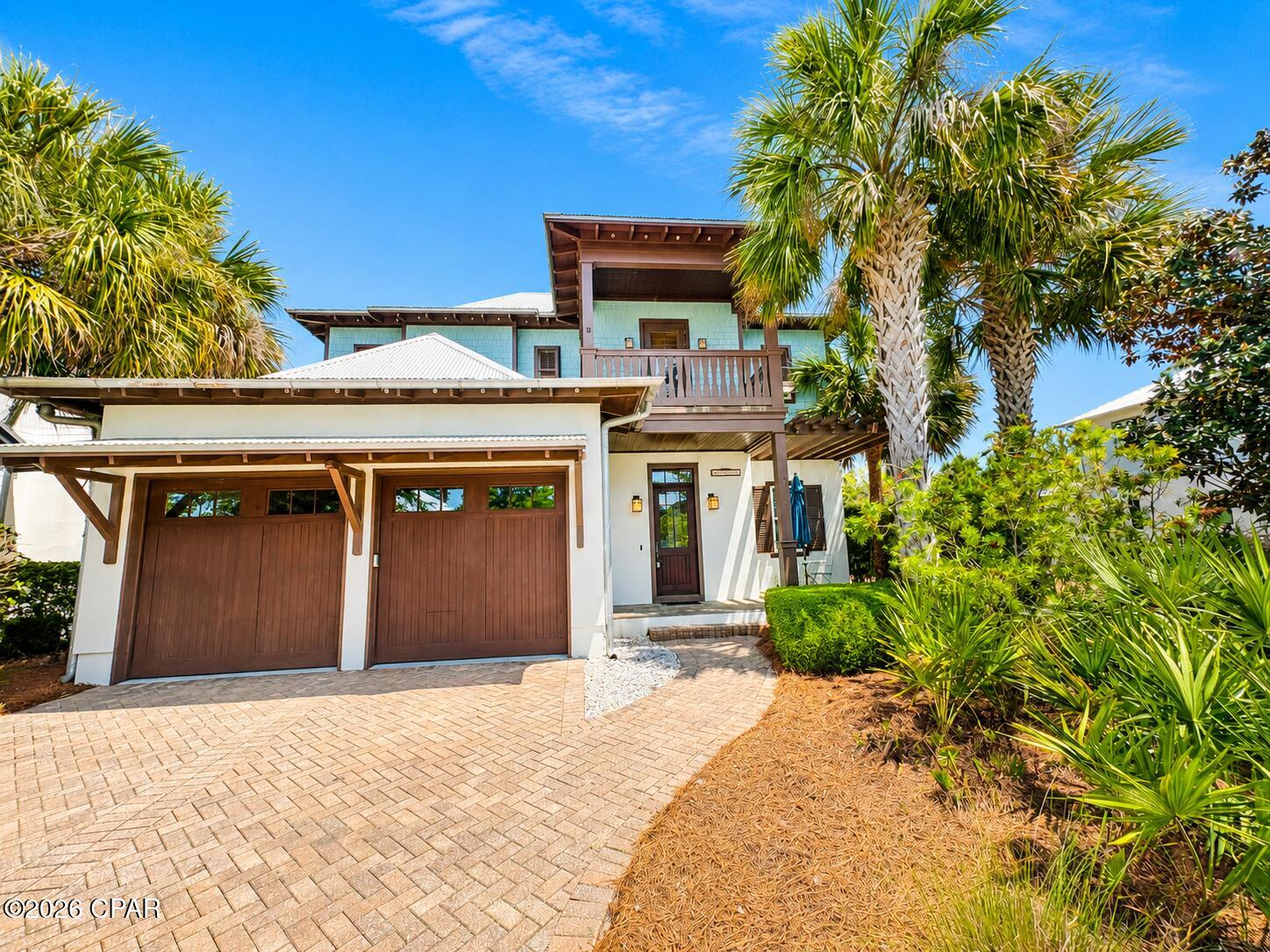 Welcome to a truly exceptional home in the prestigious, gated beach community of Martinique, where luxury, privacy, and coastal charm come together. This beautifully designed residence offers an inviting, open interior filled with natural light, highlighted by soaring ceilings, custom wood beams, and an elevated coastal aesthetic that feels both warm and refined.

At the heart of the home, the gourmet kitchen shines with premium stainless steel appliances, stylish finishes, and seamless flow into the spacious living area--perfect for entertaining family and friends. Every detail has been crafted for comfort and convenience, creating a space that feels upscale yet effortlessly livable.

Step into your private outdoor oasis, complete with a  outdoor fireplace. Overlooking a peaceful pond and tucked within a quiet courtyard, this space offers year-round enjoyment--ideal for morning coffee, evening gatherings, or simply unwinding in the fresh coastal air.

A generous downstairs flex room adds versatility to the home and can easily serve as a dedicated office, formal dining room, media room, or additional living space.

Located in one of the most coveted coastal communities, just moments from the beach, this home delivers the perfect blend of luxury living, low-maintenance lifestyle, and serene surroundings. Properties with this level of quality and outdoor amenities rarely come available--don't miss the opportunity to make it yours.