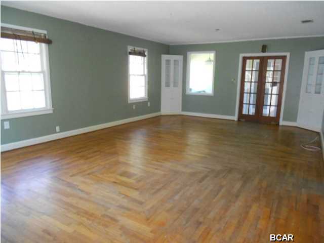 Lovely home in Historic Millville. New metal roof less than 2 years old, Original wood floors, enclosed front porch, garage, yard is completely fenced.