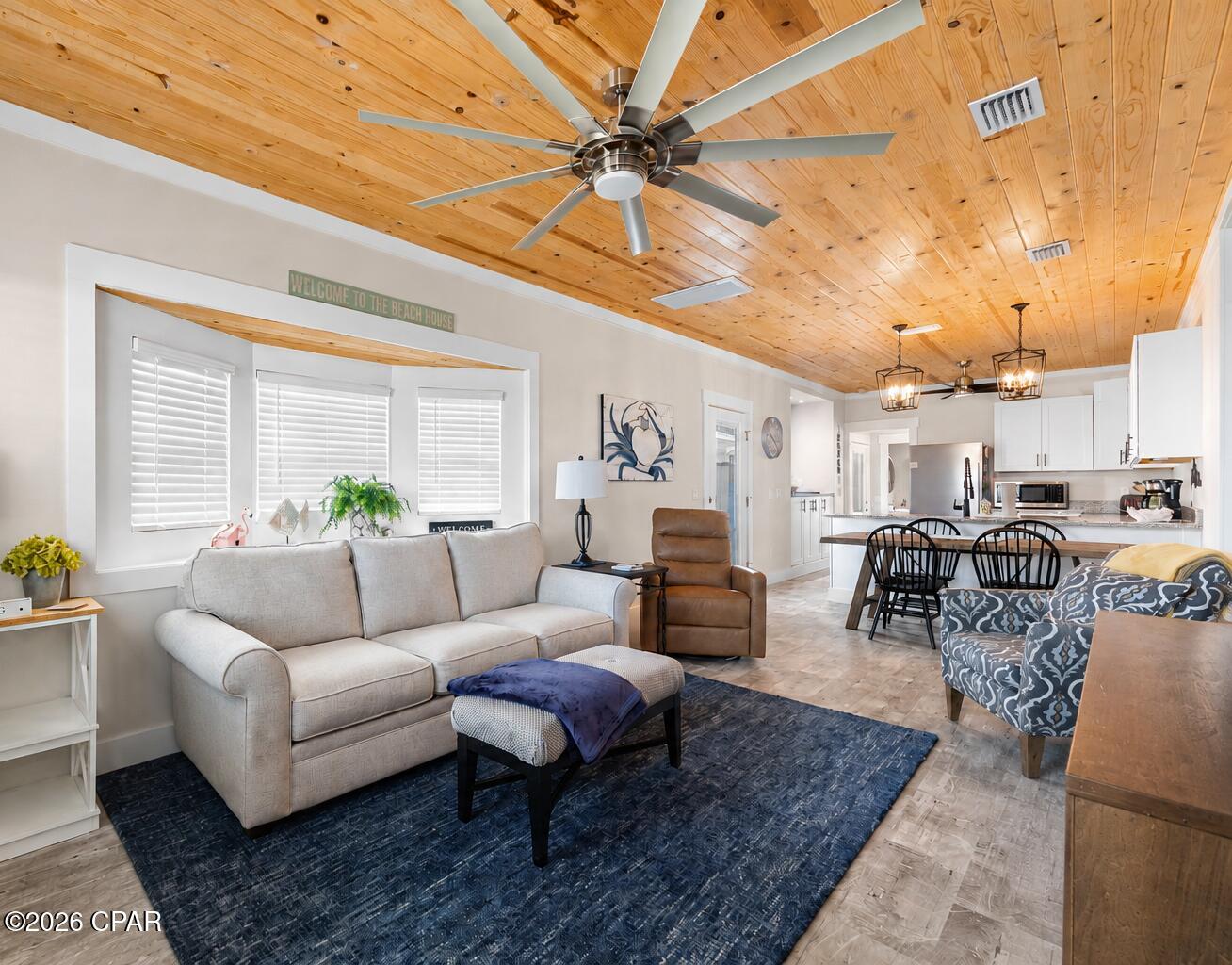 Welcome to your perfect beach retreat in the highly sought-after Venture Out Resort! Completely renovated in 2022, this beautifully updated 2-bedroom, 2-bath home offers the ideal blend of coastal charm, modern finishes, and investment potential. There's even a bonus bunk room that provides flexible sleeping accommodations or a cozy retreat for adults.

Step inside to discover an inviting open-concept floor plan featuring soaring vaulted tongue-and-groove wood ceilings, luxury vinyl plank flooring, and abundant natural light throughout. The spacious living area flows seamlessly into the beautifully appointed kitchen, complete with white shaker cabinetry, granite countertops, stainless steel appliances, a farmhouse sink, and a large breakfast bar perfect for entertaining.

The primary suite offers a private bath and comfortable accommodations, while the guest bedroom and second full bath provide ample space for family and friends. Every detail of this home was thoughtfully updated during the 2022 renovation, creating a move-in-ready property that is perfect as a primary residence, second home, or vacation rental investment.

Outside, you'll find low-maintenance landscaping, private parking, and outdoor space to relax after a day at the beach and a convenient outdoor shower! Located within Venture Out, a gated golf-cart-friendly community featuring private beach access, two swimming pools, tennis courts, pickleball courts, a fishing pier, boat launch, playground, and 24-hour security.

Whether you're looking for a personal getaway or a turnkey income-producing property, this beautifully renovated home is ready to enjoy from day one. Schedule your private showing today and experience the Venture Out lifestyle!