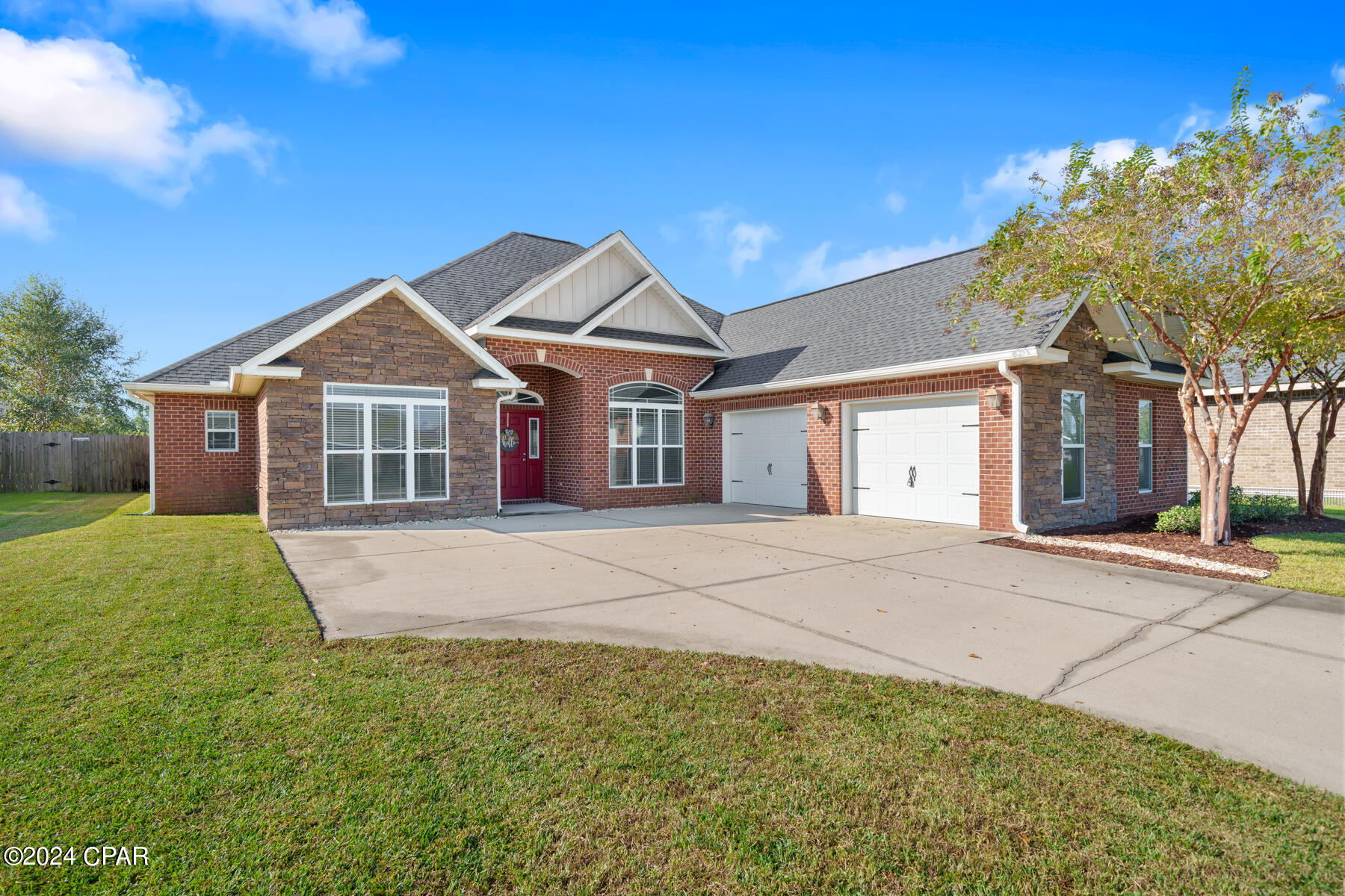 Take a step inside this beautiful family home located in The Meadows neighborhood. As your approach the home you notice the lush lawn, and beautiful trees out front. You have plenty of parking with two garage spaces, and four driveway spaces. Stepping inside right into the foyer you have two sets of French doors in the great room that bring in tons of natural light. The 9' and 12' ceiling add so much height and a larger feel to the space. To the right of the foyer, you have a formal dining area, in front of a large, beautiful window overlooking the front yard. Walking into your great room leading into the kitchen, you have a breakfast bar, and a nook for a small table. This is a great space for breakfast before school, and homework time for the kids while cooking dinner. The kitchen is equipped with stainless steel appliances, solid wood cabinetry, granite countertops, a large walk-in pantry, and travertine tile flooring. The laundry room is located right off the kitchen and dining area, with extra storage space available. The primary bedroom is located off the great room with coffered tray ceilings, two large walk-in closets, and recessed lighting. The primary bedroom has an en-suite bathroom with a separate garden tub, standing tile shower, a separate toilet room, and double vanities. There is a spare bedroom, that is a great size, on this wing of the home, as well as a half bathroom at the end of the hallway for guests. On the other side of the home behind the kitchen you have two more guest rooms that are perfect in size, as well as a full bathroom with double vanities. The bathroom has a separate shower/toilet room for added privacy. All bedrooms have large walk-in closets with closet systems for functionality. Step onto the screened in back porch to enjoy the cooler weather without the pesty insects. There is space for you to grill, or have extra seating on the extended patio that is not screened in. A beautiful firepit area has been added with borders & rocks ensuring it stays easily maintainable, has room for many guests, and the beautiful lights strung above add the perfect, charming touch while being surrounded by the flower boxes with year round plants. You can be sure to enjoy those cool evenings making s'mores with your family and friends while having the large privacy fenced backyard for the kids to play. The two car garage is oversized to ensure you have room to store your holiday decorations, lawn equipment, and recreational games inside while your cars are parked inside as well. For golf enthusiasts, there is a golf course within the neighborhood. The irrigation for this property is ran from the irrigation from the golf course so you can water your grass anytime without worrying about your water bill rising. HOA covers landscaping at front and common areas of neighborhood, discounted golf rates to residents in The Meadows, and you also have first pick to North Bay Haven Charter School. This home is located close to very great schools, grocery stores, restaurants, shopping, lakes and parks, and Tyndall Air Force Base.
If important buyer to verify all measurements and information.
Washer and Dryer do not convey.