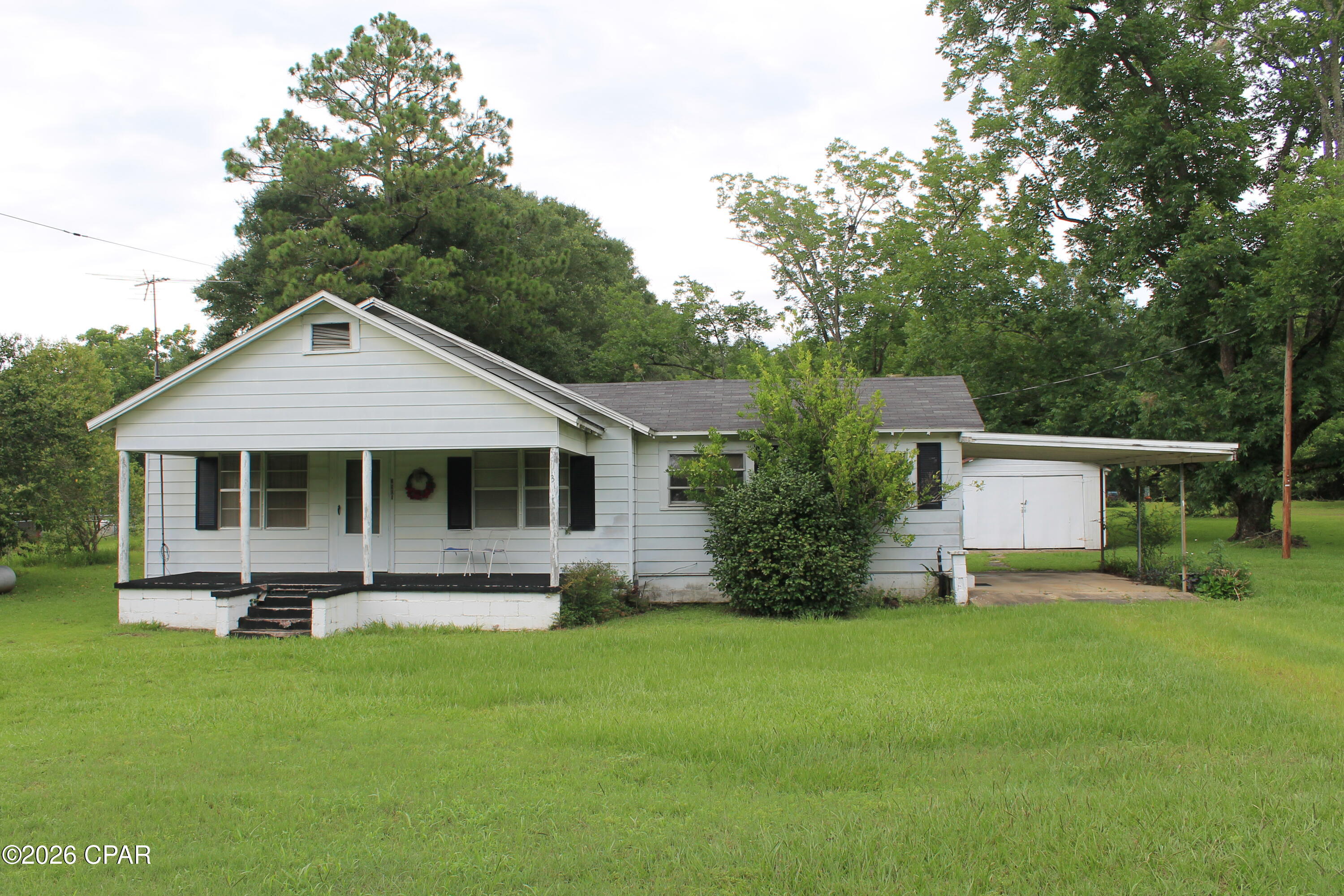 This country homestead on approximately 2 acres with pecan trees and a couple of out buildings is awaiting you.  In the country and close to town. Located just a short distance from local shopping, restaurants, you will enjoy the convenience of being close to everything while still enjoying the relaxed feel of country living. Whether you are looking for a place to call home or you are an investor wanting to add to your rental portfolio, this property offers plenty of opportunity and potential. This is one you will want to see for yourself. All measurements are approximate and should be verified if important. Sold As-Is