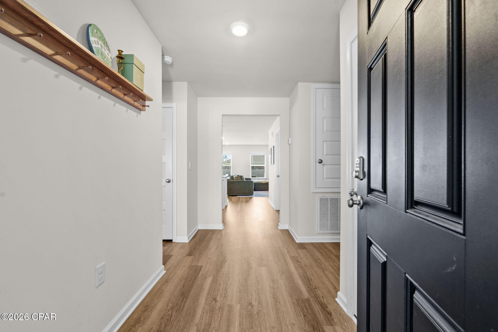 OPEN HOUSE!
FRI 5/29 4-6PM & SUN 5/31 11AM -1PM
Welcome to 7066 George Day Lane in the highly sought-after Liberty community of Panama City! This move-in ready 3-bedroom, 2-bath home offers the perfect combination of modern design, everyday comfort, and valuable upgrades already completed for you. Best of all, the street construction is complete, allowing you to enjoy an established neighborhood feel without the inconvenience of ongoing building nearby.

Inside, you'll find a bright open-concept layout with durable vinyl plank flooring throughout the main living areas, granite countertops, white soft-close cabinetry, stainless steel appliances, and a spacious kitchen island ideal for entertaining or casual dining. The thoughtfully designed split-bedroom floor plan provides privacy for the primary suite while still offering comfortable guest bedrooms and bath space for family or visitors.

The spacious primary suite features a double vanity, walk-in shower, and large walk-in closet. Throughout the home, you'll appreciate features that many new construction homes do not include, such as installed blinds and a fully fenced backyard with 6-foot white vinyl fencing for added privacy and security. The refrigerator can also convey with an acceptable offer, making your move even easier.

This home is also equipped with smart home technology, allowing you to conveniently manage features right from your phone, along with a professionally installed 3-stage water filtration system for enhanced water quality throughout the home.

Additional highlights include a two-car garage, dimensional shingle roof, and underground utilities. Residents of Liberty enjoy access to incredible community amenities including two pools, a splash pad, playgrounds, pickleball courts, basketball court, fitness center, yoga room, and more.

If you're looking for a newer home where the upgrades are already done and the home is truly move-in ready, 7066 George Day Lane is one you won't want to miss.
