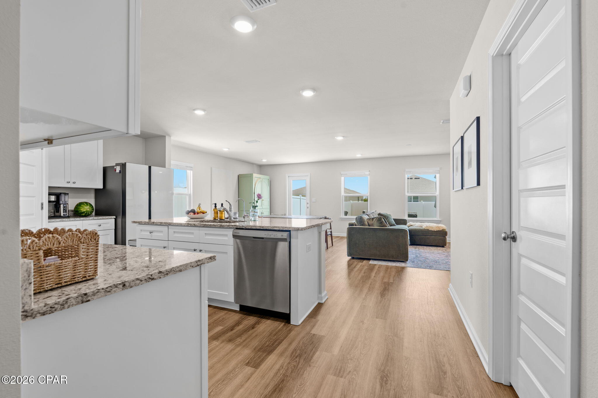 OPEN HOUSE!
FRI 5/29 4-6PM & SUN 5/31 11AM -1PM
Welcome to 7066 George Day Lane in the highly sought-after Liberty community of Panama City! This move-in ready 3-bedroom, 2-bath home offers the perfect combination of modern design, everyday comfort, and valuable upgrades already completed for you. Best of all, the street construction is complete, allowing you to enjoy an established neighborhood feel without the inconvenience of ongoing building nearby.

Inside, you'll find a bright open-concept layout with durable vinyl plank flooring throughout the main living areas, granite countertops, white soft-close cabinetry, stainless steel appliances, and a spacious kitchen island ideal for entertaining or casual dining. The thoughtfully designed split-bedroom floor plan provides privacy for the primary suite while still offering comfortable guest bedrooms and bath space for family or visitors.

The spacious primary suite features a double vanity, walk-in shower, and large walk-in closet. Throughout the home, you'll appreciate features that many new construction homes do not include, such as installed blinds and a fully fenced backyard with 6-foot white vinyl fencing for added privacy and security. The refrigerator can also convey with an acceptable offer, making your move even easier.

This home is also equipped with smart home technology, allowing you to conveniently manage features right from your phone, along with a professionally installed 3-stage water filtration system for enhanced water quality throughout the home.

Additional highlights include a two-car garage, dimensional shingle roof, and underground utilities. Residents of Liberty enjoy access to incredible community amenities including two pools, a splash pad, playgrounds, pickleball courts, basketball court, fitness center, yoga room, and more.

If you're looking for a newer home where the upgrades are already done and the home is truly move-in ready, 7066 George Day Lane is one you won't want to miss.