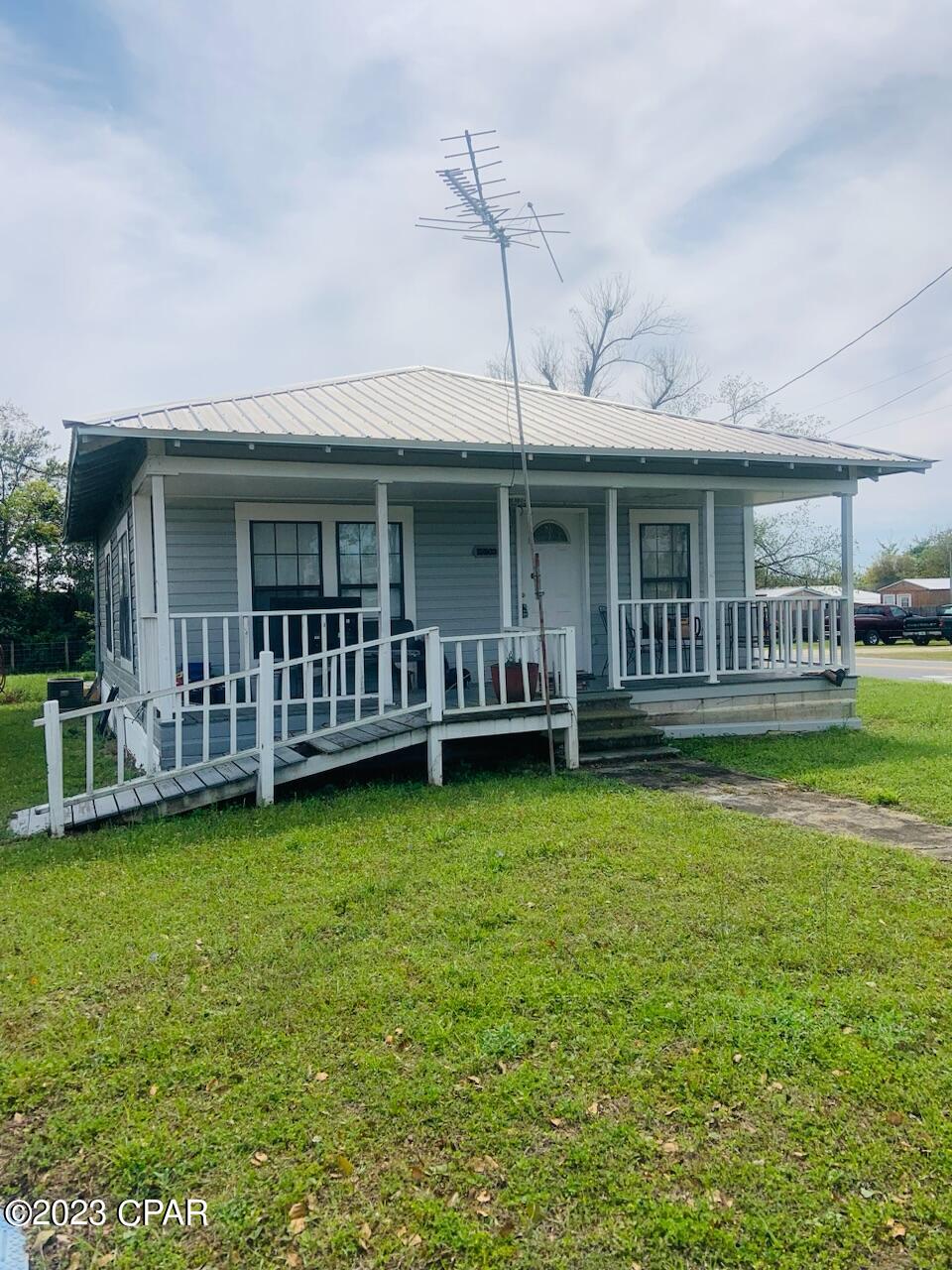 2 bed 1 bath home in a rural Florida town, situated on a corner lot with paved frontage on both.  1 hr to Panama City and Tallahassee FL. Just minutes to the Chipola River. Home has been producing rental income for years.  Metal Roof and many other renovations completed over the last 5-6 years, per seller. Great starter home or investment. Call to set up showing today. All measurements are approximate, please verify if important.