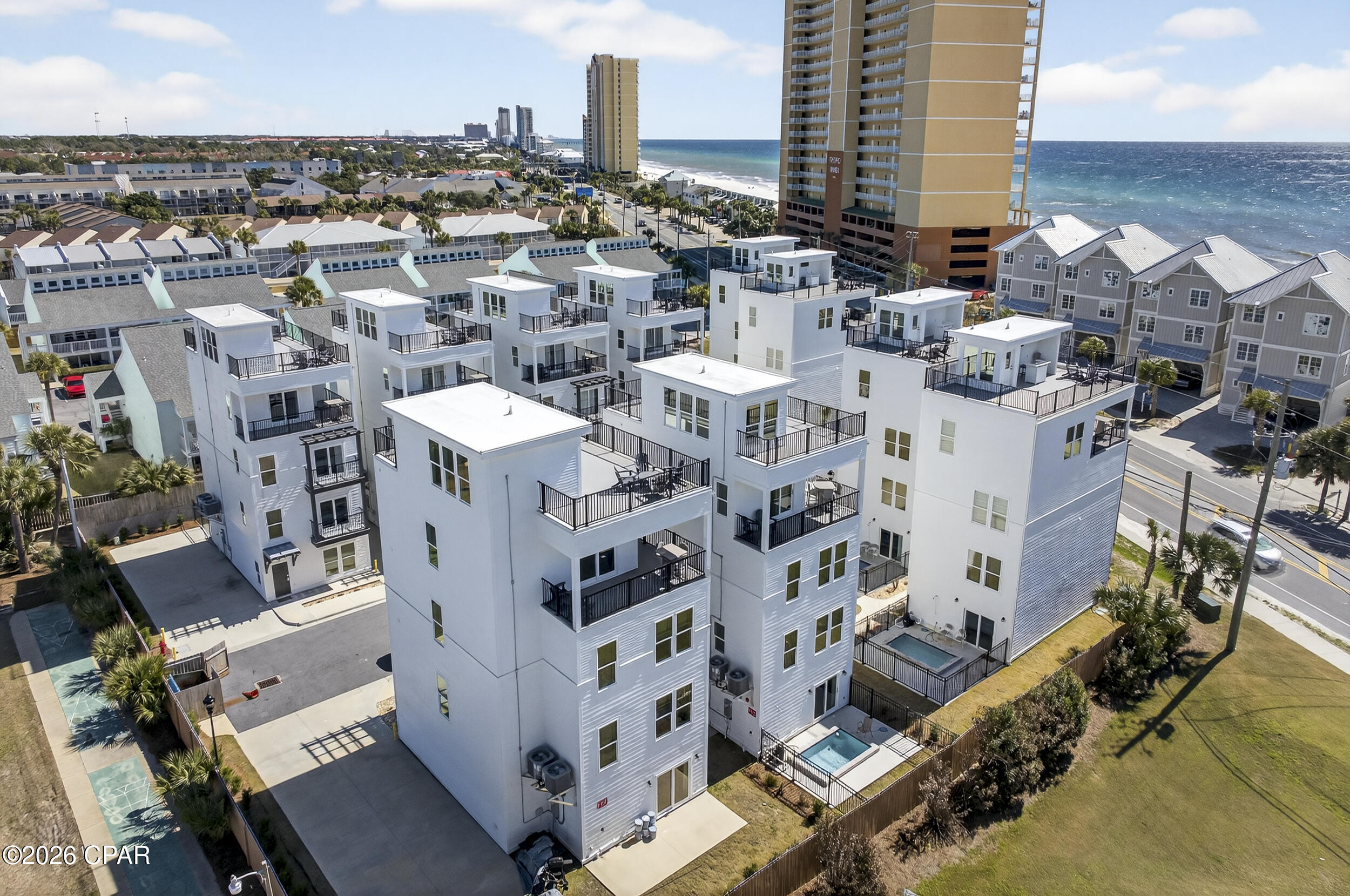 A rare offering in Panama City Beach, Laguna Villas is a private enclave of ten gulf-view luxury residences, presenting an exclusive opportunity to acquire a turnkey boutique collection in a proven short-term rental market. Each 5BR/5.5BA villa features modern finishes, private plunge pools, rooftop terraces, and direct access to public beach access 72 and 73, all designed to maximize guest appeal and premium nightly rates. Located just minutes from Pier Park, world-class dining along 30A, and popular Gulf Coast attractions, these gulf-view vacation rentals offer the perfect blend of luxury, exclusivity, and strong income potential. This fully integrated collection of ten residences is a rare investment opportunity in one of Florida's top-performing beach rental markets.