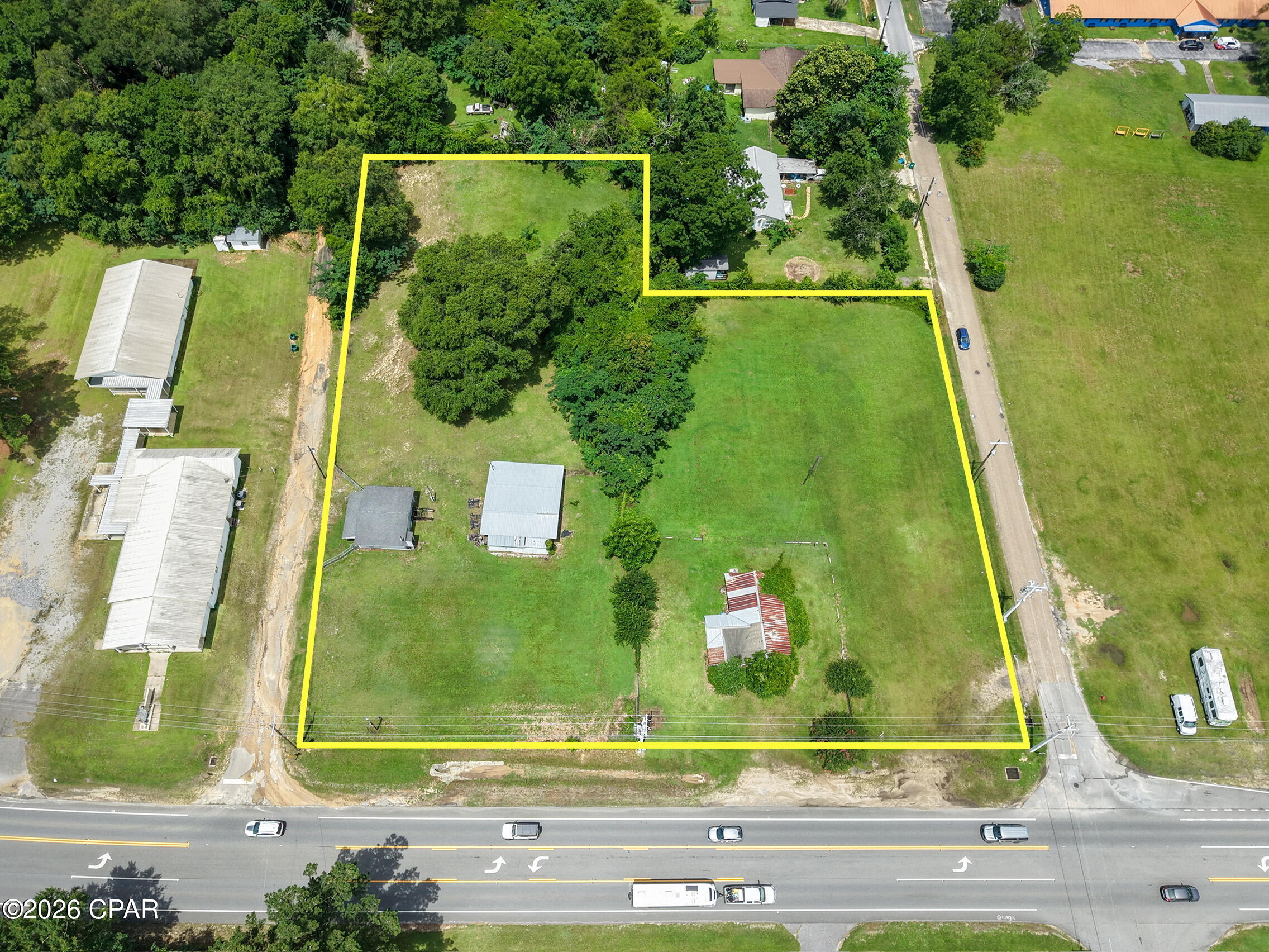 Great opportunity with a total of 2.101 acres located on a main road in Bonifay, offering excellent visibility and potential for future use. The front parcel consists of 1.721 acres and is zoned Mixed Use, providing flexibility for a variety of possibilities. The remaining acreage is currently zoned residential and would require rezoning for commercial or mixed-use plans. Existing buildings are considered to have no value, allowing buyers to focus on the land and location. Whether you are looking for a site with investment potential, future development options, or a high-visibility location, this property is worth considering.