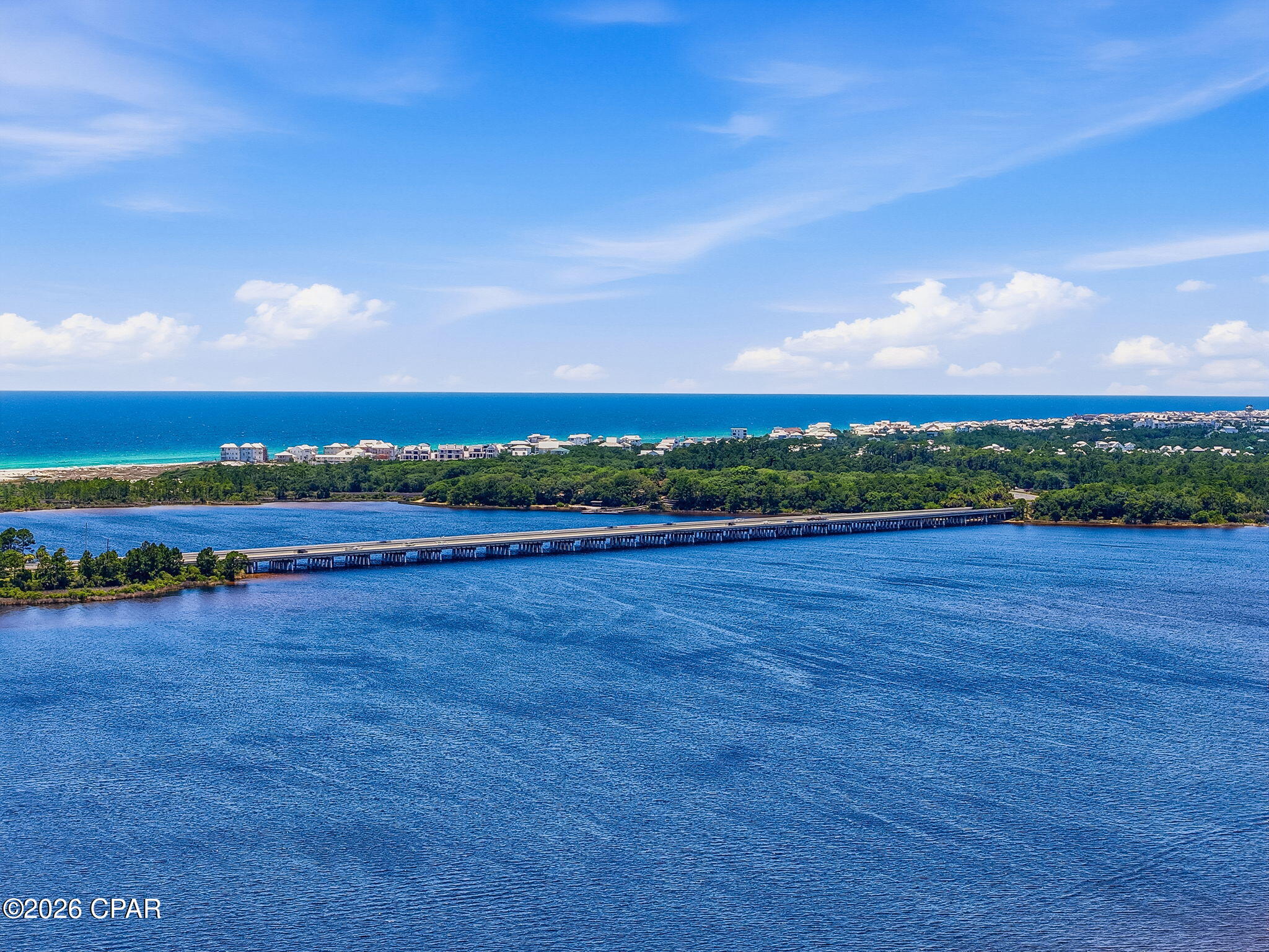 Tucked behind the private gates of Wild Heron, this exceptional homesite spans nearly half an acre and enjoys a serene setting bordered by lush natural vegetation along the renowned Shark's Tooth Golf Course. Encompassing more than 734 acres with frontage on the rare coastal dune Lake Powell, Wild Heron is celebrated as the coastal Sanctuary for its seamless blend of luxury amenities, distinctive architecture, and preserved natural beauty. Residents enjoy an unparalleled lifestyle where tranquil surroundings, championship golf, and the area's unique coastal ecosystem come together in perfect harmony.

Community amenities include a lakefront boathouse and dock, heated pool and hot tub, family park area, walking paths, health club, and lakeside fire pit. Residents also have the opportunity to access the Shark's Tooth Golf Course designed by Greg Norman and hydro-clay tennis facilities through a Clubs by Joe membership. NO short term or long term rentals allowed. Neighboring lot is for sale.