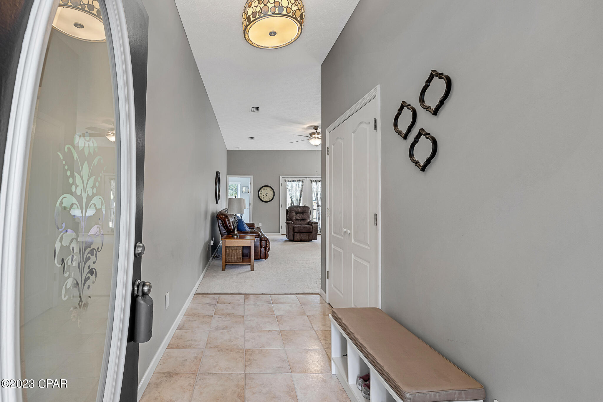 This residence is located in the highly desirable subdivision of Delwood Point at the Preserve. Conveniently located near the Navy Base, St. Andrew's State Park and the white sandy beaches of Panama City Beach, Florida. Split floor plan with 3-bedrooms and 2-bathrooms, coat closet by the front door, light and airy dining area next to the living room. Kitchen has a custom professionally-built pantry and indoor laundry room. Both the primary bedroom and living room have access to the covered porch for out-door grilling and views of your spacious manicured backyard. All major appliances have been replaced within the last 5-years. There's also a generator plug on the right side of the home that could be used as part of a whole-house backup power solution.
Driveway has an additional parking space, so you can park 2-cars inside the garage and up to 3 more in the driveway. Water heater is from 2018 and the HVAC from 2011 has just been serviced. All Information is deemed to be reliable, but is not guaranteed, buyer to verify if important.
