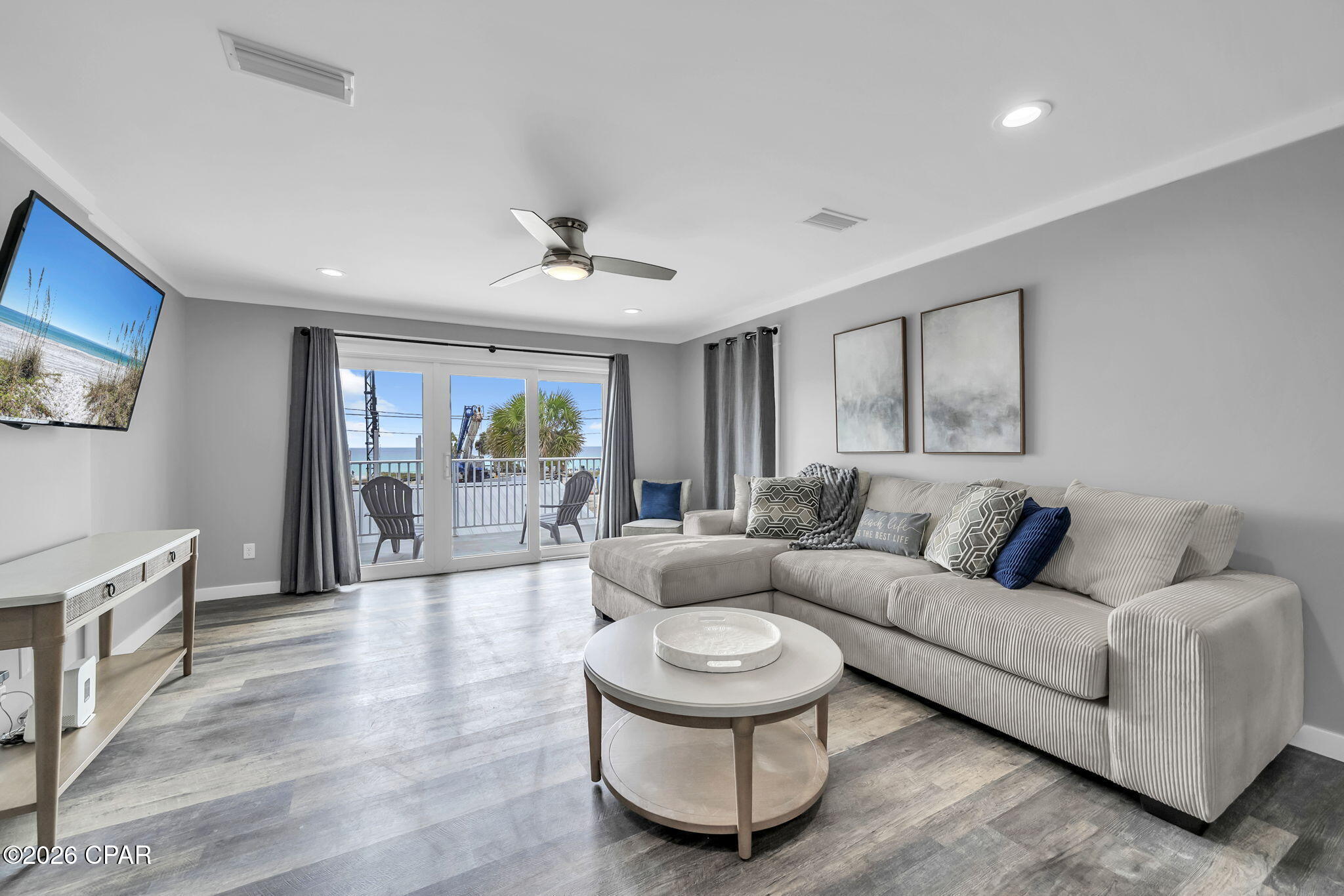Directly across the street from the Gulf, this 2 bedroom, 2 bathroom townhome offers quick beach access, Gulf views, and updates that help reduce near-term maintenance. Two public beach access points are nearby, and the home is being sold fully furnished, making it a practical option for personal use, a second home, or rental use. For buyers exploring added rental flexibility, the neighboring townhome is also available, creating a rare opportunity to own side-by-side units.

Inside, the layout is set up to comfortably host guests with one king bed and two queen beds. The kitchen, bathrooms, and flooring were renovated in 2019, and the entire unit was freshly painted in 2025, including the walls, trim, and doors. All furnishings were also replaced in 2025, giving the interior a clean, updated feel. A full-size washer and dryer adds everyday convenience.

The living area opens to a private patio where you can enjoy Gulf views and coastal breezes. A fenced backyard provides private outdoor space to unwind after time at the beach. The home also includes a private garage for beach gear, bikes, and other coastal essentials, plus additional driveway parking for guests.

Nearby destinations include Pier Park, St. Andrews State Park, marinas, waterfront dining, shopping, and local restaurants. Buyer to verify all dimensions.
