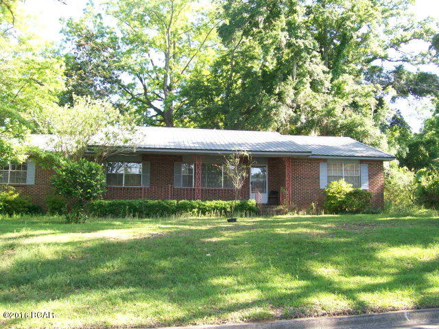 3 Bedroom, 2 Bath home, located in the City of Marianna. Features a large two car carport with decorative block work and a concrete drive, formal living and dining rooms, eat-in kitchen with spacious breakfast room for a table that opens into the backyard patio. The utility room is spacious enough for a home office or study area. Ceilings are Spanish lace, new flooring, fresh paint and recent metal roof. Central Heat (gas) and Air. Convenient location, walk to breakfast at the Waffle Iron, Family Dollar or Winn Dixie! Note: No refrigerator or dishwasher.