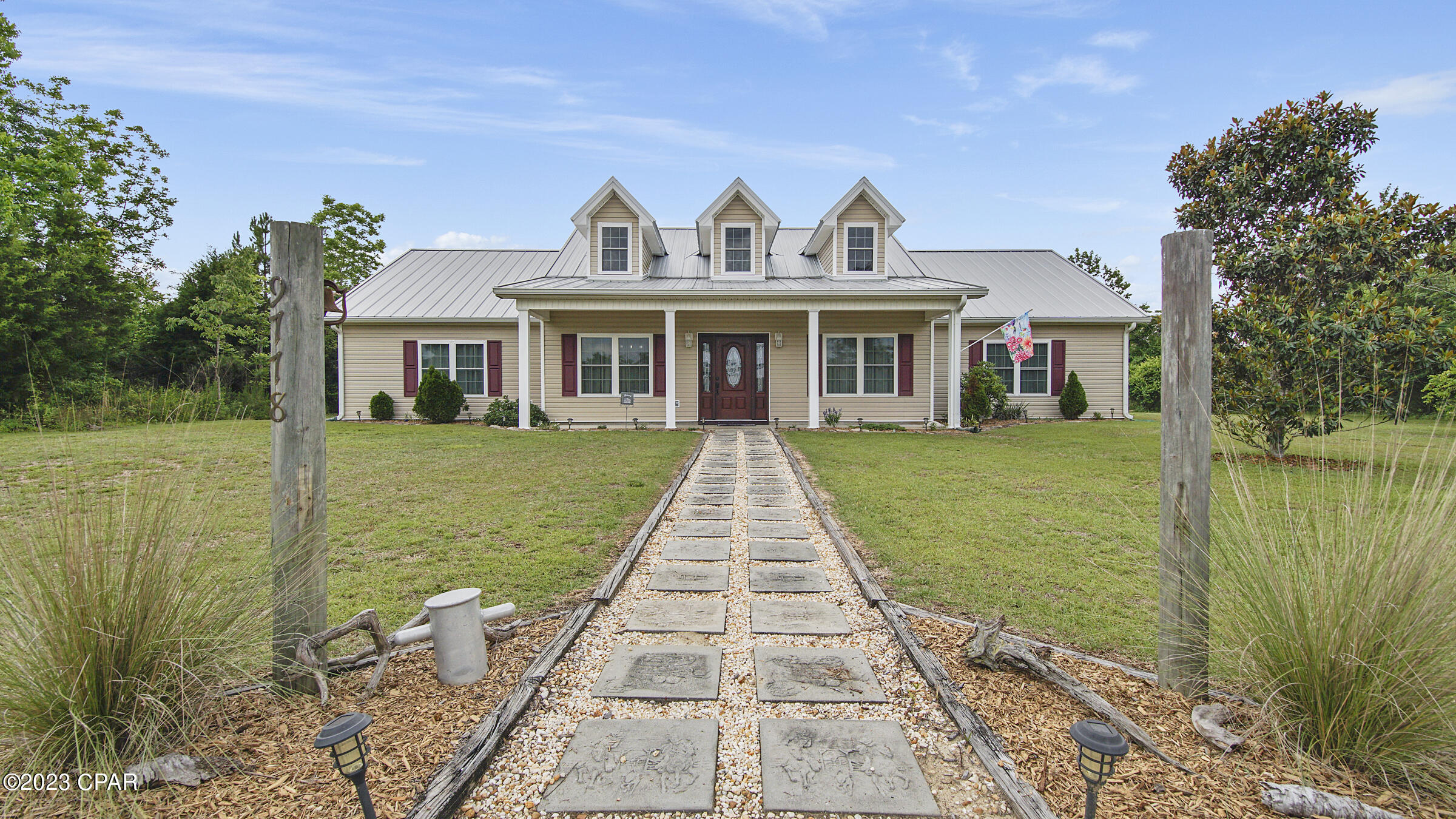 ''Welcome to country living at truly some of its finest''!!  This stunning 2668 sq.ft. beautifully maintained home is situated on 30 acres & currently 3 cleared acres.  It features 4BR, 3.5BA w/bonus room that leads out to a covered porch. The backyard is a joy to behold, where you can enjoy relaxing days/nights, or entertaining family/friends in your above ground pool.  This home also has a new standing seam metal roof, new windows, new siding, insulation, new gutters, an updated barn workshop... ALL post hurricane Michael. Freshly painted & Luxury Vinyl Plank flooring instaled.  VERY nice chicken coupe with automatic door ( egg producing chickens can convey ). Greenhouse & garden fenced area.  NEW driveway!!  Seller is leaving tree stands on site.  50 amp for RV camper @ pole barn.  Two separate and operating septic's & water wells to use for RV and/or future second home. Wandering Trail to Your pond, plus MANY ACRES available to either hunt the lush wildlife on sight, OR clear & build to expand even more. There's a creek that runs through the wooded right side of property!  SELLER WILL transfer current home warranty that covers EVERYTHING, unlike most, and include another year!! Call today to schedule your private showing! Measurements are approximate, verify if important.