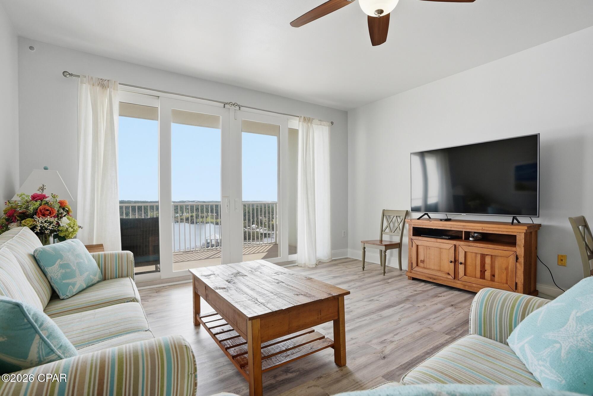 Enjoy resort living in this never-rented condo at Laketown Wharf, a spacious 2 bedroom, 2 bath condo with a bunk nook offering 1,262 square feet of comfortable coastal living with lake view just steps from the Gulf of Mexico. A rare find in this resort community, this unit has never been rented, making it exceptionally well-maintained and ideal as a primary residence, second home, or future vacation rental.

The open floor plan features a large living area, full kitchen, and private balcony, while the bunk nook provides additional sleeping space for guests. Laketown Wharf is known for its incredible resort-style amenities including five pools, hot tubs, fitness center, lakefront boardwalk, and the nightly fountain and light show.

Owners and guests enjoy onsite dining, shops, and entertainment including Juan Taco, PCB Pizza & Wings, Sunshine Bar & Grill, The Wharf Seafood Buffet, Candymaker Ice Cream Shop, Laketown Market, and 810 Billiards & Bowling featuring bowling lanes, arcade games, billiards, and more. Located just across the street from the beach and within walking distance to Pineapple Willy's and local attractions, this property offers the ultimate Panama City Beach lifestyle.