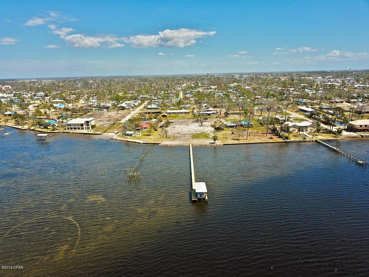 Sellers Says Bring Me An Offer Lets Make The Numbers Work! SELL SELL SELL! 

WOW! 50 feet of bay front with seawall and boat dock also 10,000 Pound boat lift! This property is 300 feet deep with plenty of room for large home, pool and green space. Bay front yard facing the west for the best sunsets in the world. Just a quick boat ride to shell island! House plans are available for this site.Additional bay front footage available at this time.