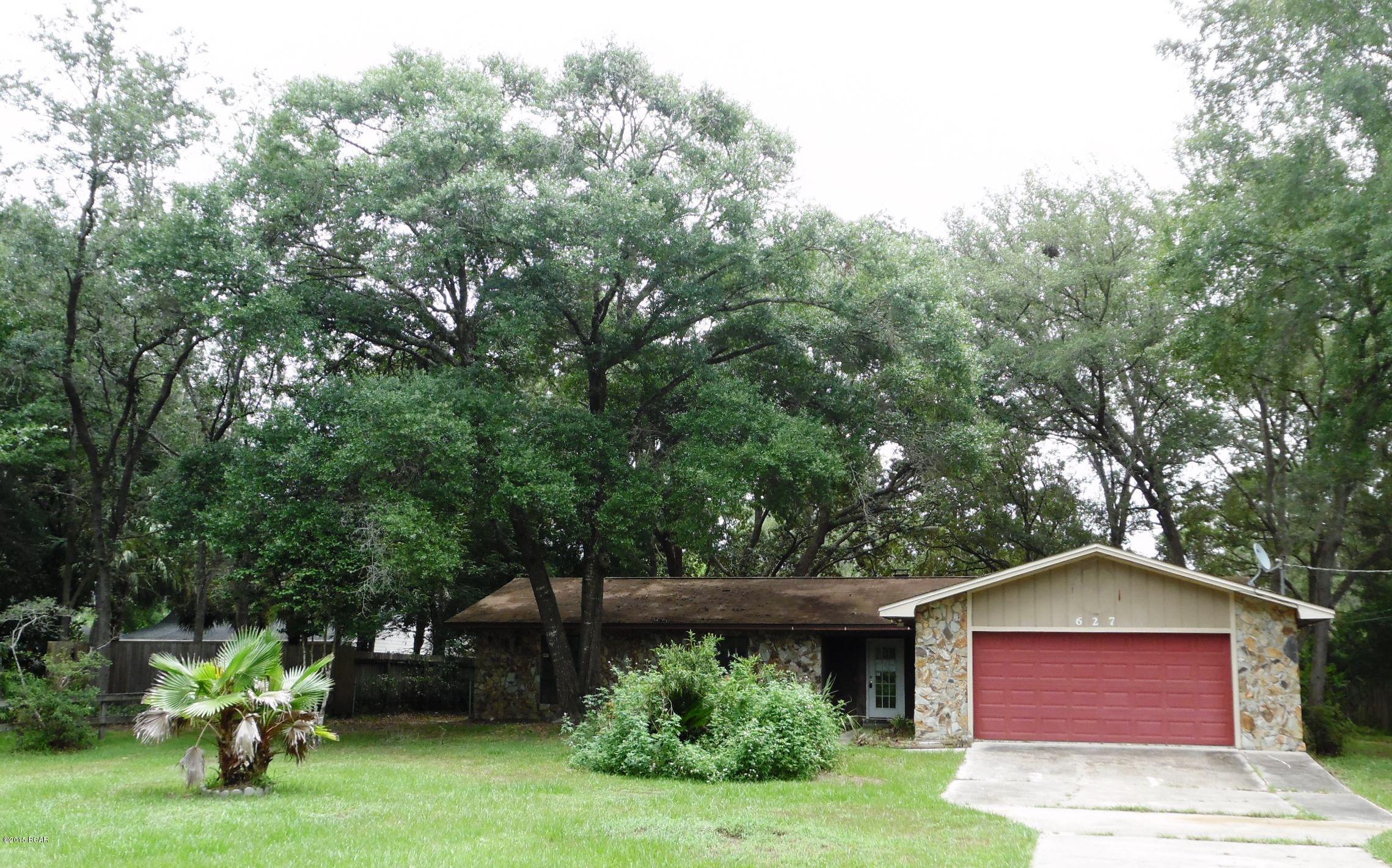 Don't miss this opportunity to own a waterfront home, on .86 acre at a great price. This home has lots of space with a sunny Florida room, 3 bedrooms, 2 baths and an oversized 2 car garage with additional storage space inside. On the exterior, you'll enjoy lots of privacy since this home sits way off the road, while still boasting a huge back yard, all the way to the lovely waterfront. Great fishing from your own back yard is just one of the perks. There is also a massive detached garage/workshop in the rear of the property, with easy access through the side yard.