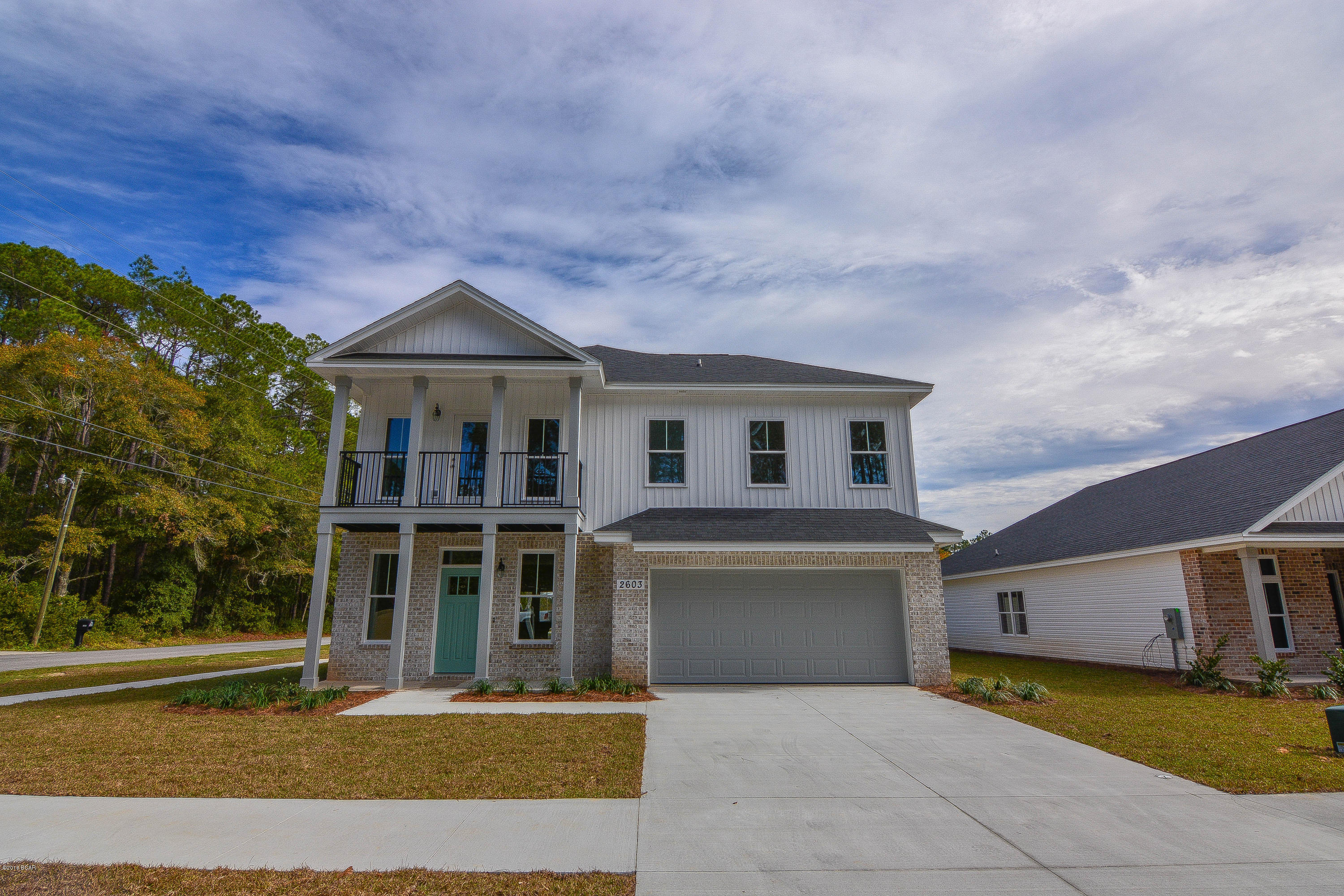 Beautiful New construction in Lynn Haven by one of the Areas most prestegious builders. This home is loaded with extras, custom cabinets, upgraded lighting package, wood looking tile floors, granite kitchen tops, custom colors..All in one of the most desirable neighborhoods in Lynn Haven. This home is ready to move in so don't  hesitate call your Realtor today to see this home it has So much more.. Call today for more information