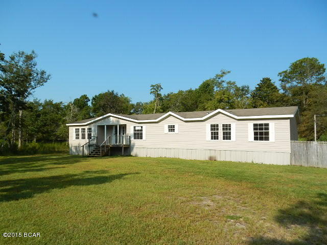 Sitting on nearly 3/4 of an acre, this doublewide offers a modern interior that includes a large living room w/built-in entertainment center and corner fireplace, split-planned master suite w/walk-in closet, master bath/spa w/dual sinks, and built-in entertainment center, dining room w/wet bar, incredible kitchen w/tiled countertops, prep island/breakfast bar, closet pantry, and stainless steel wall range hood, and 3 more super spacious bedrooms! Great location just east of 331 offering Santa Rosa Beach, Grayton Beach State Park, and Choctawhatchee Bay just minutes from your front door!  This is an outdoor lover's paradise location! EQUAL HOUSING OPPORTUNITY!