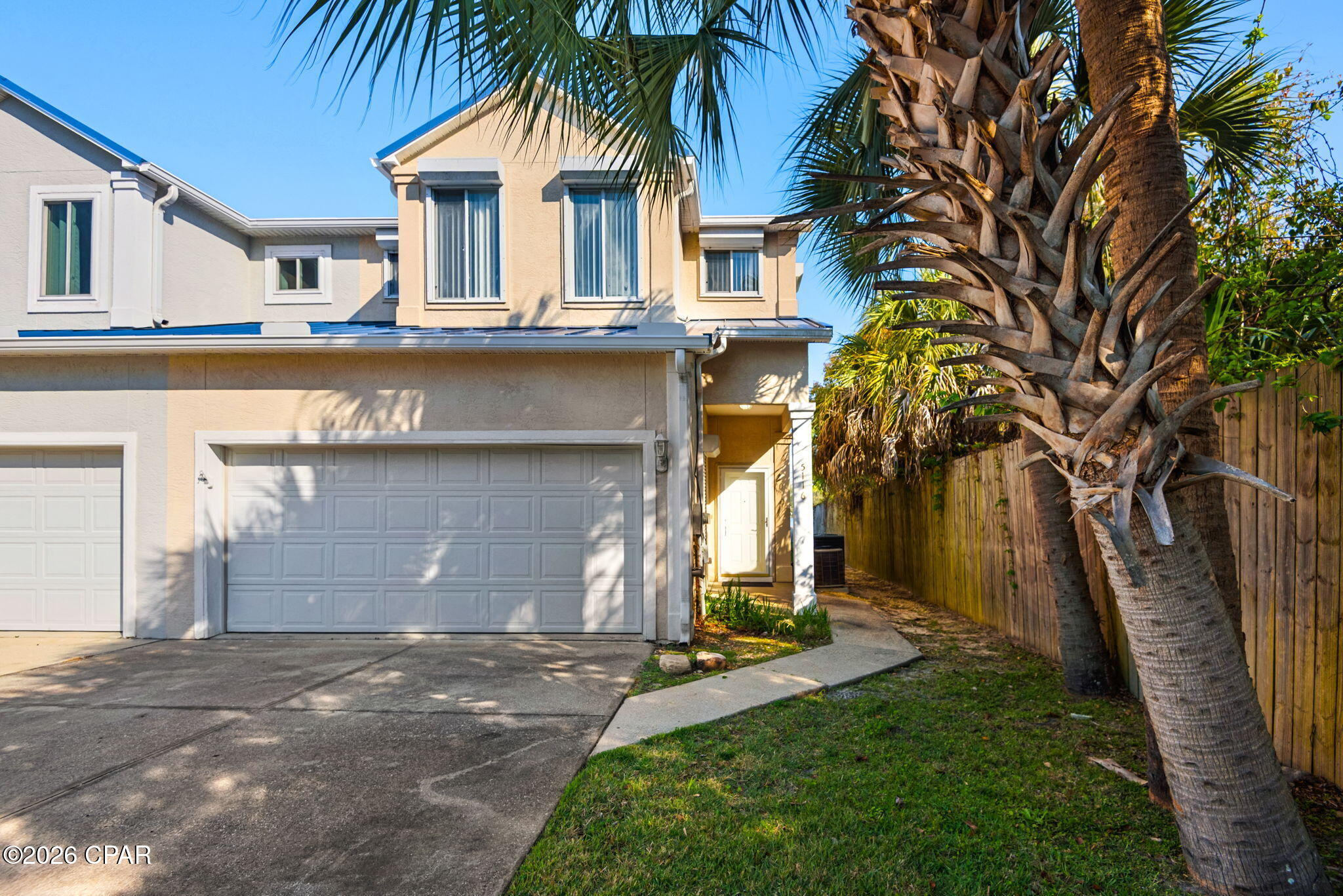 Experience the ultimate coastal lifestyle in this stunning end-unit townhome, where breathtaking bayou views and premium amenities create the perfect Florida haven. This two-story gem boasts a private boat slip and a spacious backyard, offering a seamless blend of comfort and waterfront charm. The light-filled interior features updated flooring, a cozy fireplace, and an expansive open layout designed for entertaining, complete with a convenient downstairs half bath.

Upstairs, the massive waterfront primary suite serves as a true retreat, featuring a private balcony for soaking in serene sunsets, a huge walk-in closet, and an ensuite with his-and-hers vanities, a jacuzzi tub, and a separate walk-in shower. Practicality meets peace of mind with a two-car garage, storm shutters, and a 2019 metal roof. Perfectly situated just minutes from Tyndall AFB, shopping, and dockside dining--some even accessible by boat--this home is an unbeatable find for year-round living or a weekend escape. Tour today!