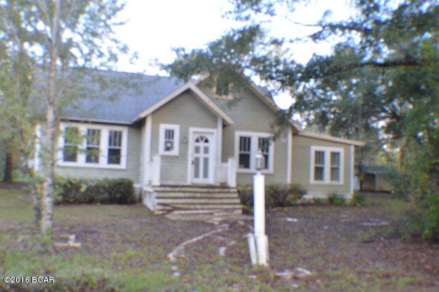 Great Location.... Cute Florida style cottage with lots of potential. Home is need of some TLC. Land corner 2 paved roads with enough land for a horse or 2. Land also has couple outbuildings