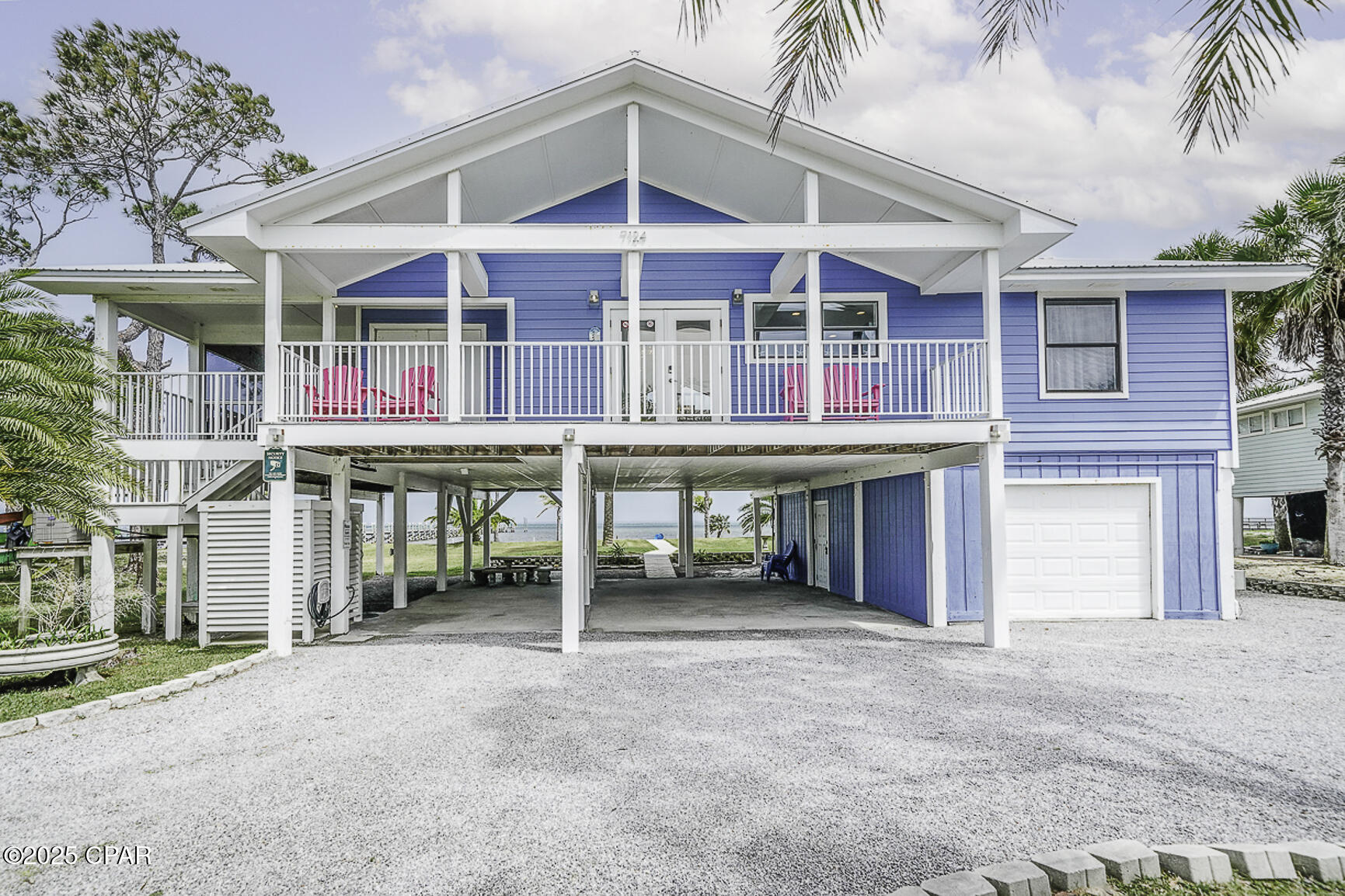 Stunning Bayfront Escape on North Cape! Whether you're searching for your forever home or a high-end vacation rental, this beautifully maintained 3-br/ 2-ba bayfront retreat offers the ultimate blend of comfort, style & coastal adventure. Situated on a large estate-sized lot with lush landscaping & swaying palm trees, this property invites you to live life to the fullest. Designed with relaxation & entertaining in mind, the spacious open-concept living area features a wall of windows that frame sweeping panoramic views of the bay. The thoughtfully planned split layout ensures privacy, with a luxurious primary suite that includes private access to the sun deck & screened porch, along with a spa-like bathroom featuring a large walk-in tiled shower extending to the ceiling. Step outside & discover everything you need to enjoy the outdoors—from a hot & cold outdoor shower to rinse off after a day at the beach, to a one-car/golf cart garage. Under the home, a covered outdoor entertaining area awaits, complete with a fish cleaning station, picnic area & kayak storage. Gather around a cozy fire pit perfect for stargazing or roasting s'mores. With direct bay access & a sandy beach just steps away, spend your days kayaking, paddleboarding, fishing, or exploring the nearby sandbars. Paddle over to St. Joseph State Park, or simply enjoy the abundant sea life & breathtaking natural surroundings. A scenic paved path runs the length of the Cape, ideal for biking or walking. The Gulf-side beach access is just a short stroll away for unforgettable sunset views. Located near charming Port St. Joe with its historic downtown, boutique shops & fresh seafood restaurants, this property offers the perfect combination of peaceful seclusion & convenient access to local attractions. Whether you're seeking a private coastal haven or a smart investment in a sought-after rental market, this stunning bayfront home is a rare opportunity. Call for a private tour today to LIVE THE BEACH LIFE!