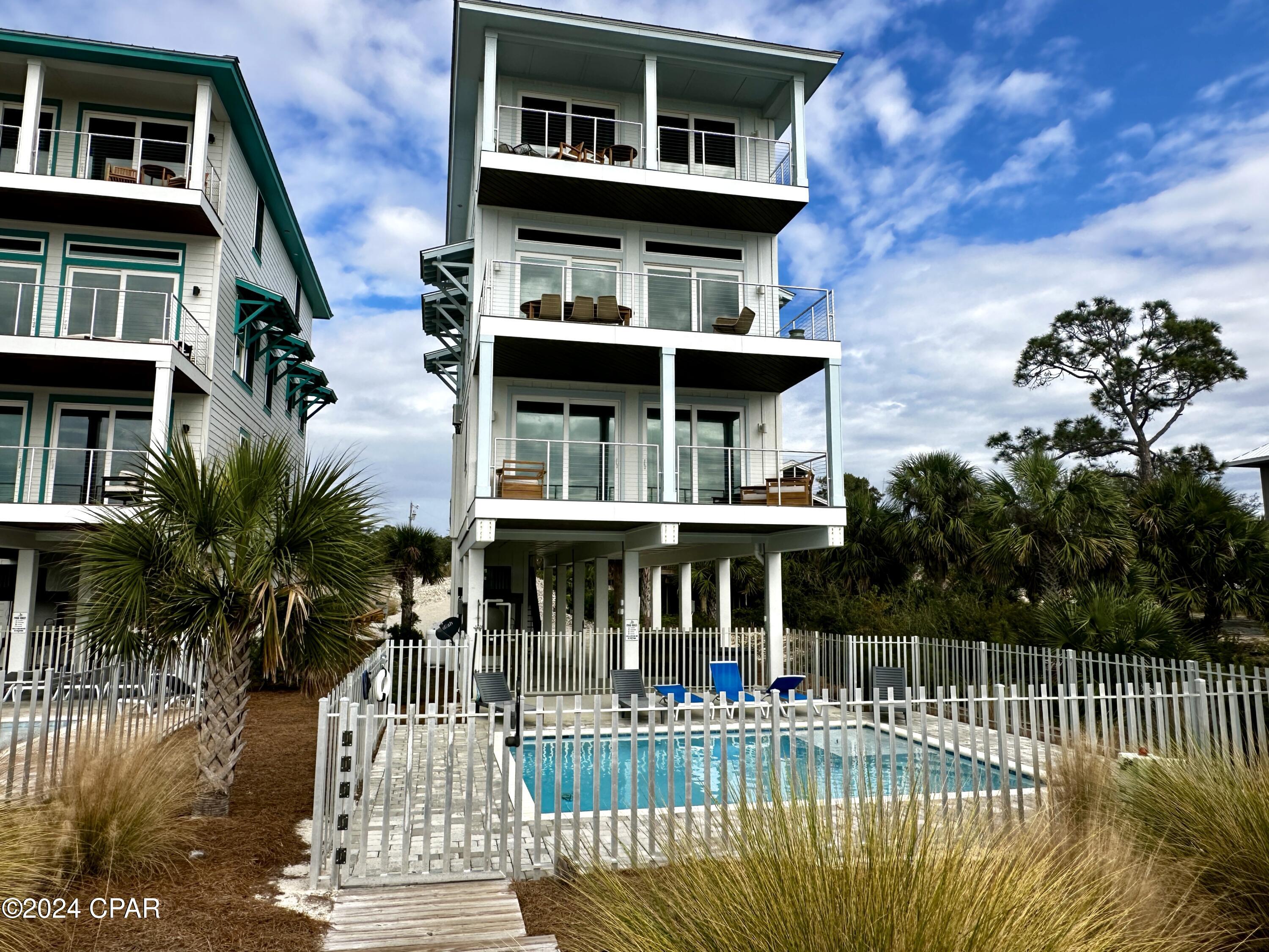 CURRENTLY UNDER CONTRACT, SELLER WILL CONSIDER BACKUP OFFERS. PREMIER LUXURY GULF FRONT 6BD/6.5BA BEACH HOUSE on Indian Pass with PRIVATE POOL. Fully furnished & rental ready, this coastal oasis offers a tremendous income-stream. An open concept kitchen, dining & living space features polished high-end finishes & warm wood accented ceilings. Relax & entertain on the sundeck just off the main area w/views of the Gulf from every angle. Two first level primary suites w/private deck access & walk in closets are embellished w/tile & glass showers. Included on this level is a children's suite w/custom bunks & double vanity. Each bedroom throughout the home has their own ensuite bathroom. The elevator extends to the 3rd level where this floor plan is replicated to maximize lodging & guest space. A sparkling private pool beckons you to relax and enjoy the soothing sounds of the Gulf. Clean your fresh catch at the fish cleaning station & throw it on the grill while lounging around your private outdoor living space. You have direct access to the beach via your private boardwalk. For local cuisine, fresh Apalachicola oysters & live music look no further than the world-famous Indian Pass Raw Bar. Call today for your private tour!!
