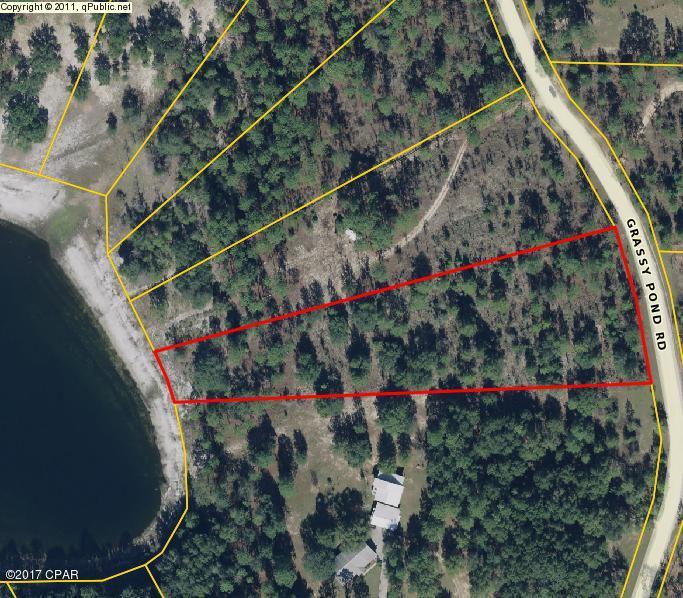 Lakefront Deal! This beautiful 3.53 Acre lot is nestled in the Grassy Pond Ranch Subdivision. It features rolling topography, hardwoods, and a gorgeous lake view from its hilltops. Its conveniently located just 30 minutes North of Panama City and Beaches International Airport. This beautiful piece is just waiting for you to build your Dream Home, or 2nd home on it! Call today to schedule your Showing!