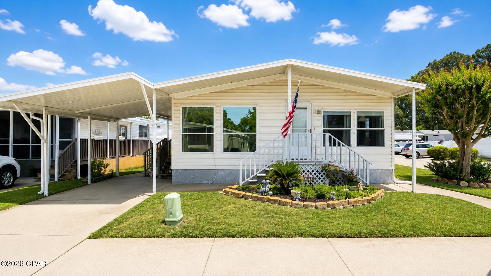 CLOSE TO THE GULF OF MEXICO! Welcome home to GREENWOOD ACRES - a coveted 55+ resort community! Conveniently located in the heart of Panama City Beach, close to PIER PARK MALL with plenty of family friendly entertainment venues, restaurants and shops!  Just a short 3-mile drive to the white sandy beaches, emerald-blue waters and warm breezes of the GULF of MEXICO! 
************RESORT LIVING:  This large beautiful 3BR/2BA home is conveniently located right next to the Clubhouse and Community Pool!  Enjoy relaxing and hosting family and friends on the large front patio deck!  As you enter the home from the patio, the natural Florida sunshine illuminates the impressive open floor plan of the huge living room!  The adjacent Dining room to both the Living Room and Kitchen complements the easy living conveniences of this amazing home!  The large Kitchen area features matching Whirlpool appliances, stackable Washer & Dryer hidden in the private closet with plenty of cabinet and pantry storage space.  The Master bedroom features a walk-in closet and ensuite private master bathroom.  The (2) Guest bedrooms has plenty of closet space with adjacent guest bathroom between them. The large corner lot offers (2) built-in 8' x 12' garden sheds for easy access with plenty of shelving and storage. 
***********HOA FEATURES:  Well-kept resort community with very low monthly dues and enjoyable planned event activities -- great for seasonal SNOWBIRDS since the HOA maintains all the landscaping and lawn care!  The HOA also includes water, sewer, trash, Wifi Internet & cable TV, large event clubhouse and beautiful community pool for only $304/month --this is clearly a bargain compared to other higher HOA dues!  There's also a private gated parking area within the resort to store your fishing boat or RV camper! ***********WELCOME HOME: No need to look any further -- this is your perfect retirement home and 55+ resort community!  Life is good, but even better in Panama City Beach!  Call me quickly to schedule an appointment as this home will not last long!