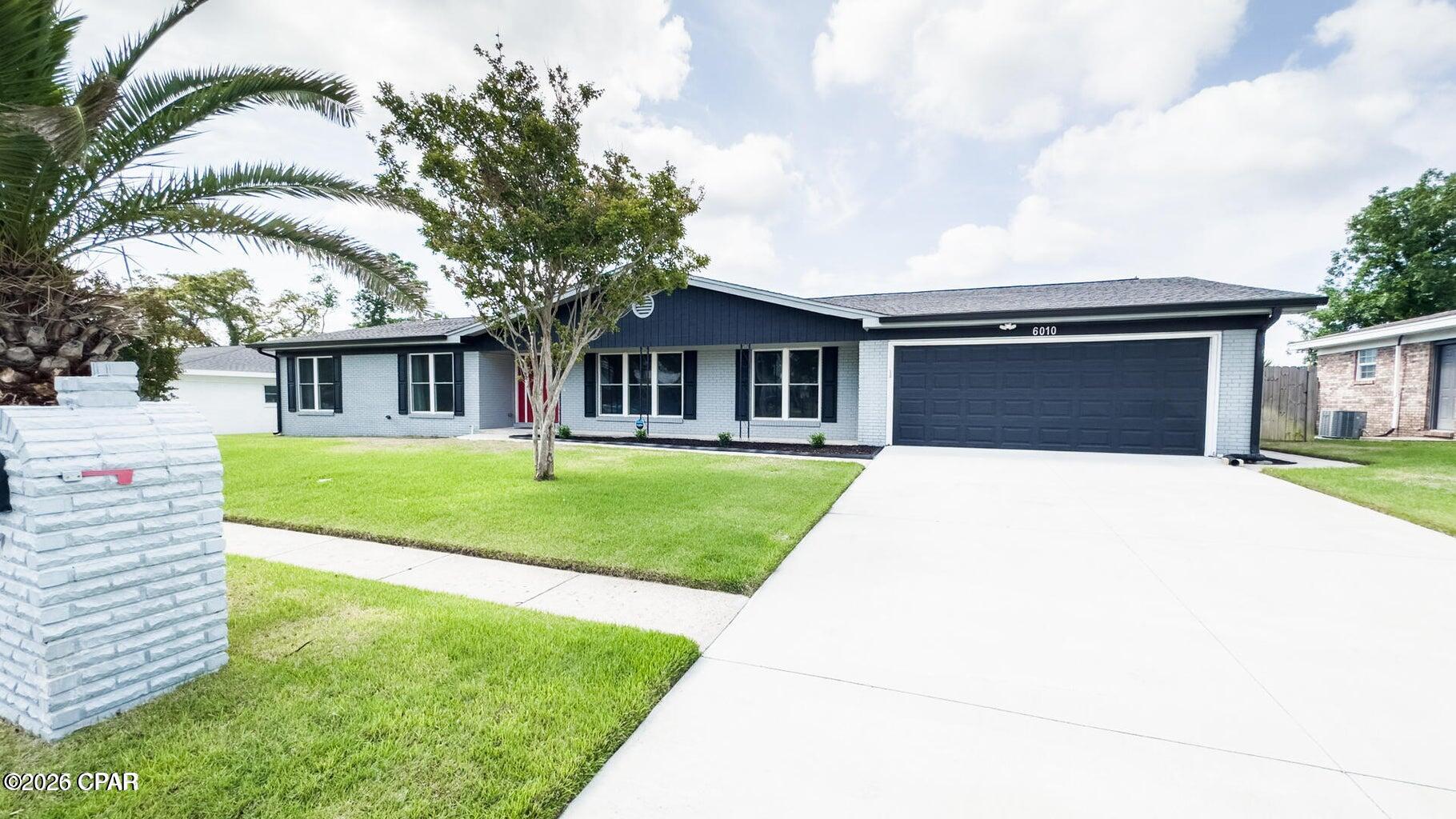This spacious 4-bedroom, 2-bath traditional brick home offers 2,518 square feet of comfortable living in a quiet, sidewalk-lined neighborhood with underground utilities. Thoughtfully updated and designed for both everyday living and entertaining, the home features an upgraded kitchen with quartz countertops, an expansive island with a breakfast bar, abundant cabinet space, and a cozy breakfast area. Formal living and dining rooms provide elegant spaces for gatherings, while a second living room offers additional flexibility. The oversized laundry room includes a convenient butler's pantry, perfect for added storage and prep space. The master suite includes his-and-hers closets and an ensuite bath, while a heavy-duty sliding glass door opens to a 12' x 24' screened-in back patio with wet rated fans added in 2023 overlooking a large, fully fenced backyard--ideal for outdoor enjoyment. Additional highlights include LVP flooring throughout, a large garage with an insulated door, and a newly installed irrigation system nourishing a lush zoysia lawn. Major systems and features--roof, windows, HVAC, electrical--were replaced in 2019/2020, new driveway in 2023 with new gable end siding added in 2024. Located near Tyndall Air Force Base, public boat launches, shopping, and dining, this home blends modern upgrades with timeless charm. Don't miss your chance to own this beautiful home!