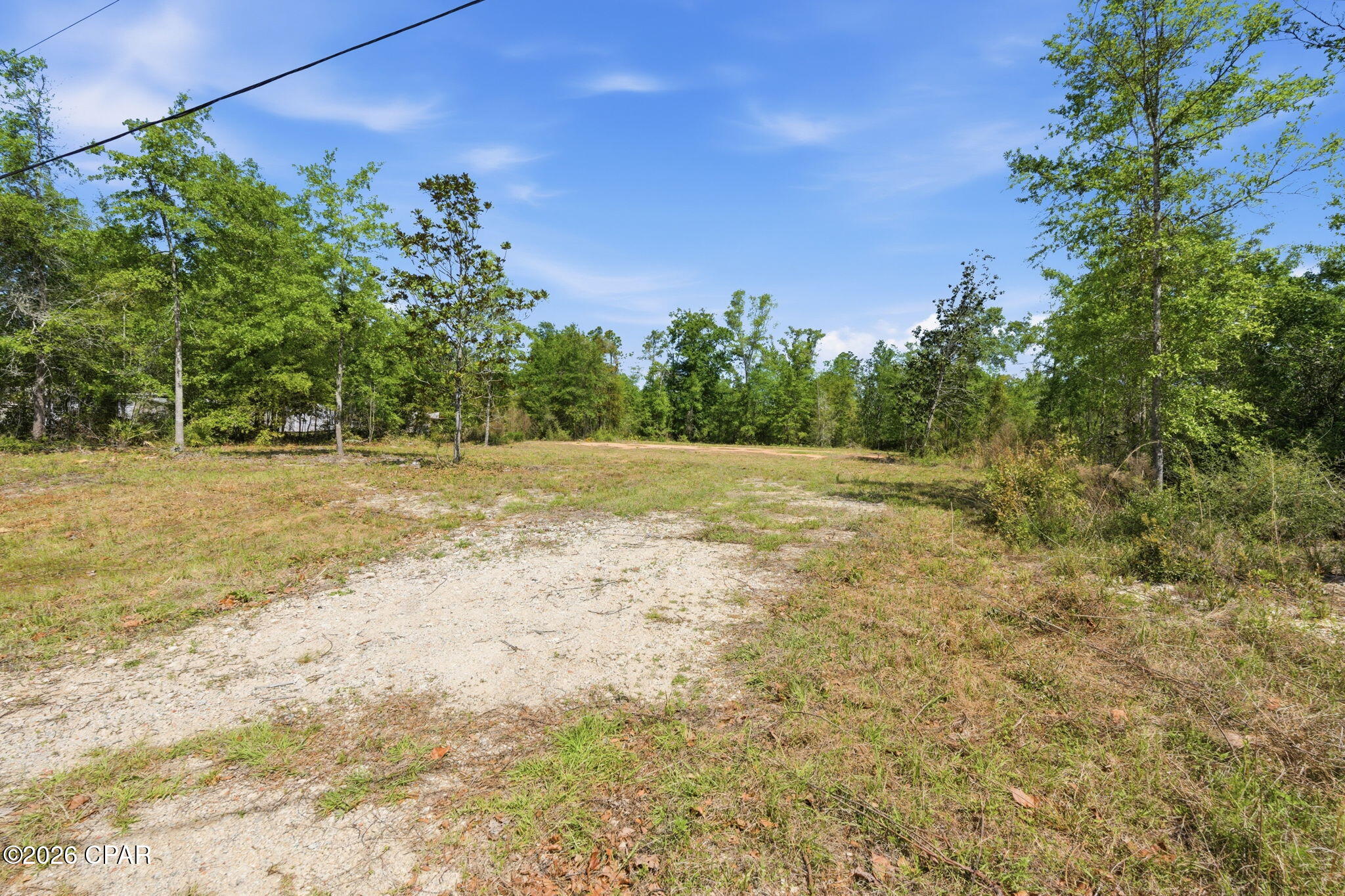 Currently under contract, seller accepting back up offers. 
This half acre lot is cleared and has a home pad, for a double wide mobile home in place. Seller has paid for a soil test, septic permit and a 911 address. 

Close to Harder's Park, which hosts sports fields, and Bay Dunes Golf Course.