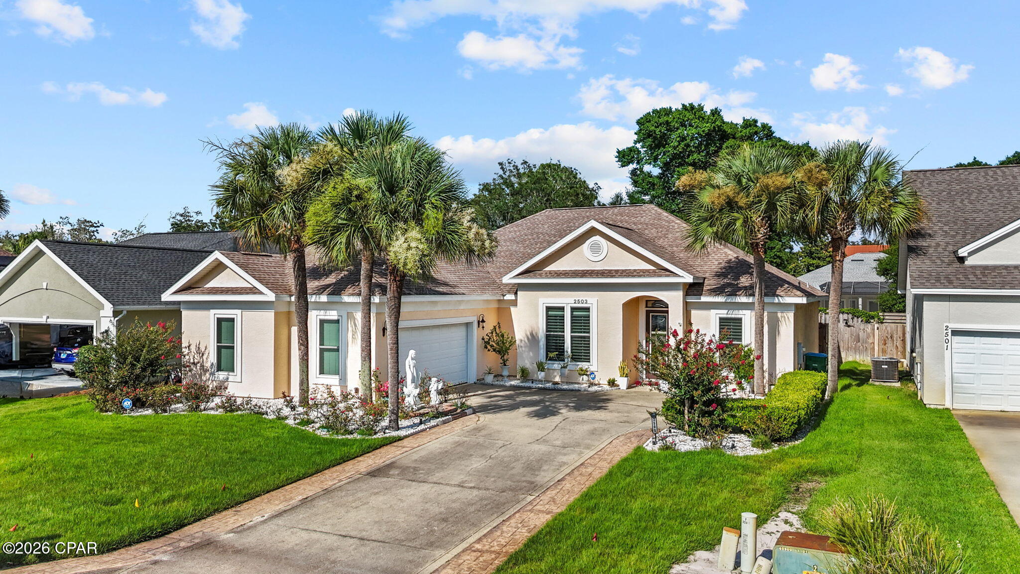 This beautifully maintained 4 bedroom/3 bath home offers the perfect combination of comfort, convenience, and coastal living. From the moment you walk inside, you'll notice how well this home has been cared for, featuring fresh paint, clean tile flooring throughout, natural light beaming through the plantation shutters and12 ft ceilings in the main living areas. Each bedrooms houses 10 ft ceilings making each room of this home feel a so spacious and airy. Outside, the yard is just as impressive, with lush green grass and great curb appeal. The neighborhood offers amenities you'll love to take advantage of including a community pool, clubhouse with BAY VIEWS and a community dock bringing luxury R&R right here at home! Location is hard to beat. You're just minutes from Bay Point Golf Club, less than a mile from Publix, restaurants, & shopping on Thomas Drive, and only 4 short driving miles to our white sandy beaches and, best of all, St. Andrews State Park. Whether you're looking for a primary residence, second home, or investment property, this one checks ALL the boxes. Pristine Clean, move-in ready, and close to everything that makes Panama City Beach such a great place to live. Come check it out.