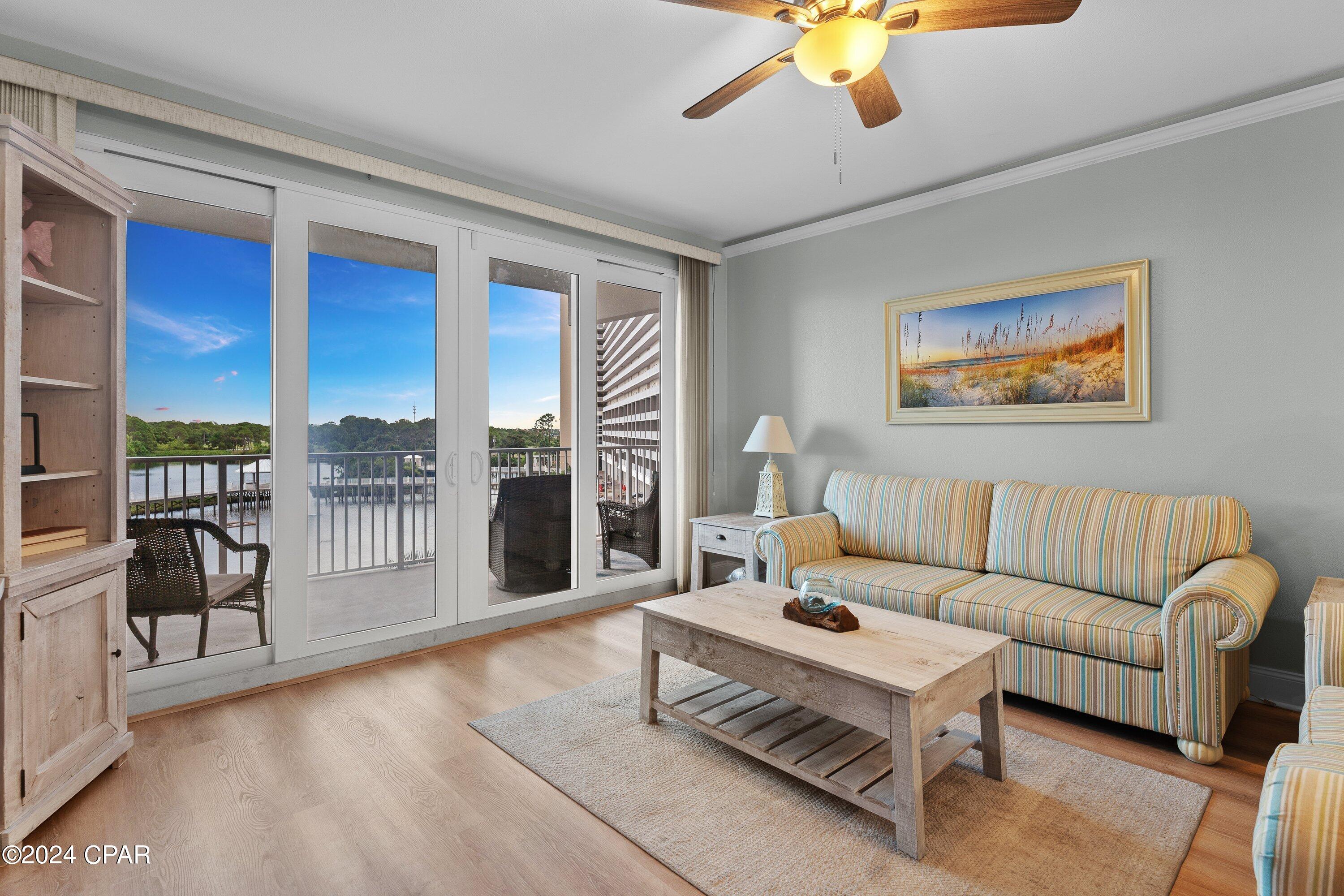 This beautifully updated, turnkey lakeview condo at Laketown Wharf offers an exceptional blend of value, style, and rental potential. Featuring 2 bedrooms, 2 bathrooms, plus a private bunk room, this thoughtfully designed condo offers approximately 1,262 square feet of comfortable coastal living and is ready to enjoy from day one whether as a personal beach retreat, full-time residence, or vacation rental investment.

The open-concept living and dining area flows seamlessly into the spacious kitchen, complete with granite countertops, a breakfast bar, tiled backsplash, and updated finishes that create an inviting space for entertaining or relaxing after a day at the beach. Recent improvements throughout the condo include a newer HVAC system (2023), water heater (2022), fresh interior paint, painted kitchen and bathroom cabinetry, updated lighting and LED fixtures, crown molding in the living room and bedrooms, and a barn door added to the bunk room for additional privacy and functionality.

Step outside onto the oversized balcony and enjoy peaceful lake views along with Laketown Wharf's nightly fountain show, creating the perfect backdrop for morning coffee or evening relaxation.

Laketown Wharf is known for its extensive resort-style amenities, including five swimming pools, a putting green, fitness center, lakefront boardwalk, beach access, restaurants, and family-friendly attractions that continue to make it one of the area's most sought-after destinations for both owners and vacationers.

Whether you're searching for a move-in-ready coastal getaway, an investment property with strong rental appeal, or the perfect blend of both, this updated condo offers an outstanding opportunity in one of Panama City Beach's most amenity-rich communities.