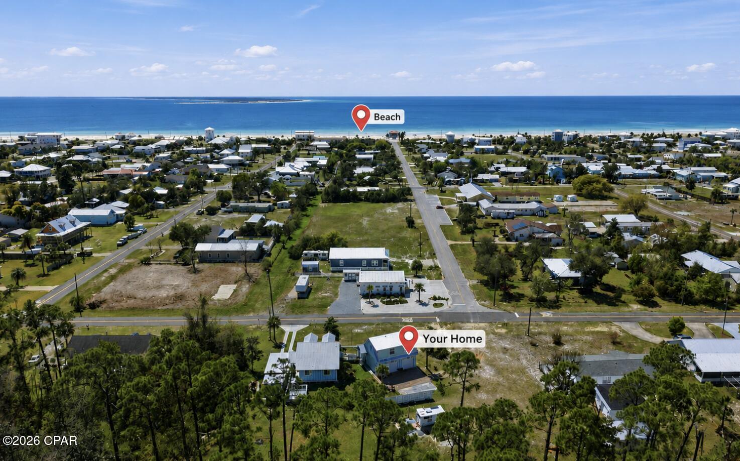 Just 1,200 feet with 2 LOTS -- about three blocks -- from the sugar-white sands of St. Joe Beach, this one-of-a-kind coastal property delivers the rare combination of true beach-town living, proven Airbnb income, and a setting you simply can't replicate. Park beachside at the end of the street, bring the dog (St. Joe Beach is the only pet-friendly beach in the area, a major draw for vacationers that a hundreds-of-guests-strong rental history proves), and walk home to nearly half an acre of peaceful, wooded privacy. Beyond the beach itself, you can walk to a local church and a nearby seafood restaurant, and you're just minutes from a boat launch, a picnic park with tennis courts, and a dog run. Historic Port St. Joe with its restaurants and antique shops is a short drive away, with Cape San Blas and Apalachicola each about 30 minutes out and Panama City roughly 45 minutes.
Built in 2017 but thoughtfully designed to reflect a classic 1930s Florida cottage, the 2-bedroom, 1-bath main home blends vintage character with modern efficiency. Vaulted ceilings and an open-concept kitchen with pantry anchor the living space, while a loft with staircase access offers potential additional living area. Modern systems include ductless mini-split HVAC, spray foam insulation, a tankless water heater, and a whole-house water filtration system. Authentic period details run throughout -- high wood baseboards, a cast iron sink, push-button light switches, brass cover plates, solid wood doors, antique lighting, and exposed ribbed metal ceilings with an acid-washed finish. Covered parking, golf cart parking, a fenced yard, an outdoor shower, and a covered walkway connecting to the garage round out the everyday conveniences.
The income potential here is already proven and turnkey. The detached oversized double garage includes a fully furnished 2-bedroom, 1-bath apartment with a private entrance, currently operating as a successful Airbnb. A separate full-service RV site with 30/50 amp service, water, sewer, and a private driveway operates as a Hipcamp rental. Combined rental income averages approximately $30,000 annually.
Outside, a large entertainment deck, paver areas, a storage building, a pergola-style canopy, and a wooded backdrop complete the setting on nearly half an acre spanning two lots. With both lots included, there is room to add a pool, build a workshop, construct another home, or sell off the back lot (buyer to verify). People buy in this area for one reason -- the beach -- and this property delivers the beach lifestyle, the pet-friendly advantage that keeps the calendar booked, two income-producing rentals, and a primary home with character you won't find in new construction. Whether you're looking for a primary residence, vacation retreat, or turnkey investment, this one checks every box. Purchase includes BOTH lots -- Parcel ID 04170-000R & 04170-002R.