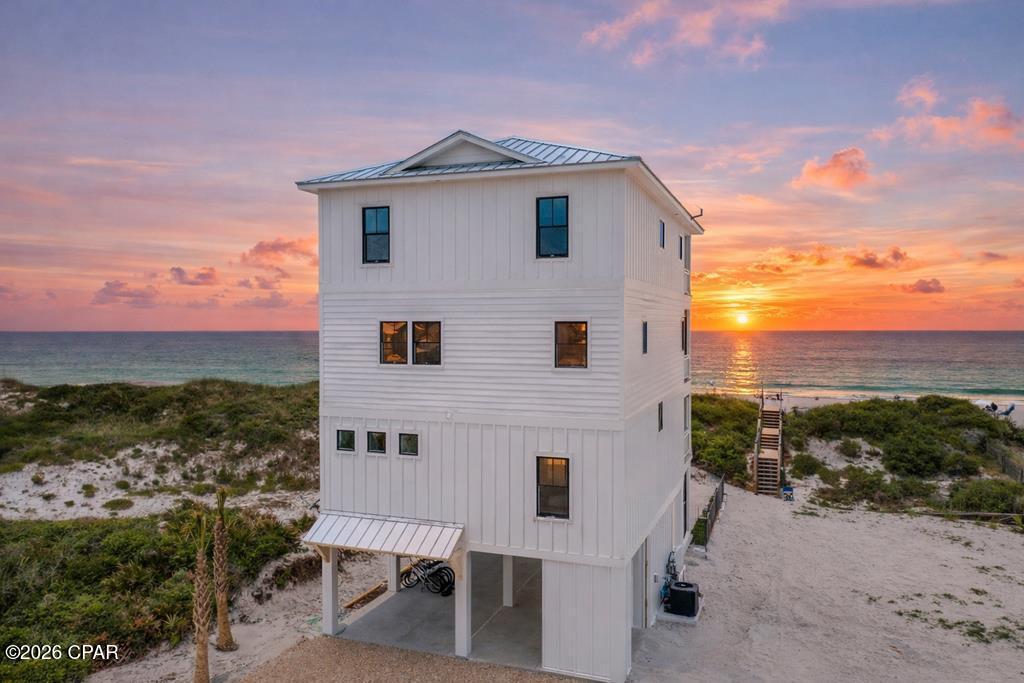 Swirly Sunsets on North Cape San Blas checks every box for an exceptional beachfront retreat. This 7-bedroom home was designed for large groups to enjoy outstanding comfort, luxury, and amenities, all overlooking the Gulf. Guests will love the heated and chilled beachside pool, hot tub, firepit, arcade room, elevator, game deck, and more in this well-built and thoughtfully designed property. Located in an area with an expansive beach and a large protective dune, this home offers both beauty and peace of mind. Personally built and owned by a local builder and Realtor, every detail of the construction and design was carefully planned to maximize space, enjoyment, durability, and rental performance. Completed in summer 2023, the home has been a proven income producer from the start, generating $280,000 in gross rental income in 2024 and $277,000 in 2025. Every finish, furnishing, and feature was selected to provide a luxurious guest experience while standing up to the demands of a high-performing vacation rental. This property is being sold fully furnished, decorated, and equipped as shown. Both listing agents are owners and will consider owner financing for up to 5 years with at least 20% down, minimum 7% rate.