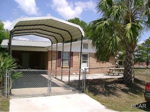 Very nice PARTIALLY FURNISHED home with marble floors throughout, washer and dryer, fenced yard and 1-car carport. Close to schools and shopping. Walking distance to the beach and the Lagoon!