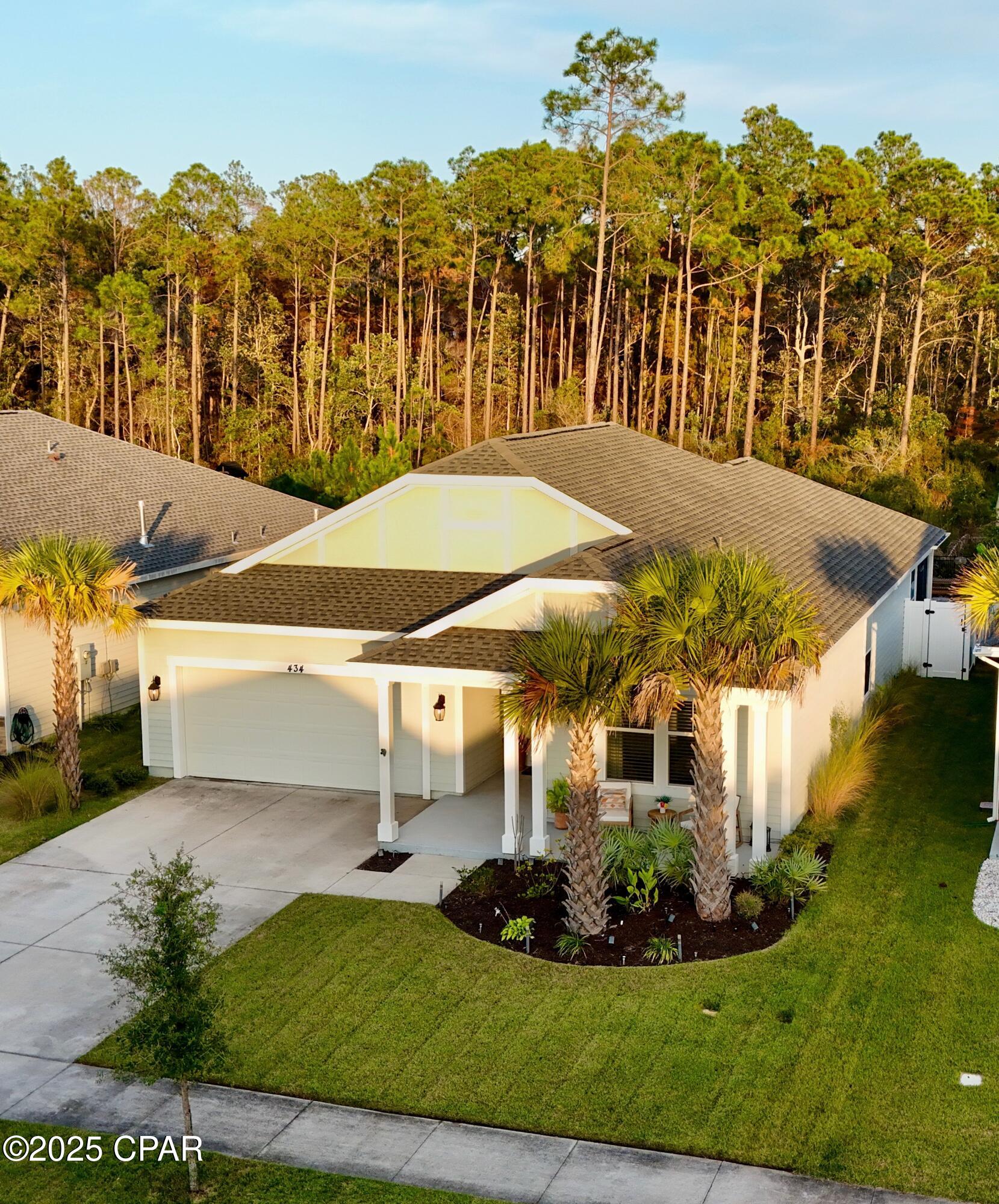 Welcome to 1630 sq. ft. of Exceptional Coastal Living Carolina Trigger by Samuel Taylor Homes!
Located in one of the hottest and most sought-after communities on the Beach, this beautifully upgraded Trigger Carolina floor plan offers the perfect blend of elegance, comfort, and quality construction.

Built above hurricane code with 2x6 exterior wall framing, a hurricane tie-down rod and anchor system, architectural shingles, and enhanced insulation ratings, this home provides peace of mind along with superior energy efficiency.

Step inside to find a thoughtfully designed single-level layout featuring 9' and 10' ceilings, custom paint, designer lighting fixtures, and new Caliwood flooring throughout. The stunning kitchen includes quartz countertops, a gas range, microwave, dishwasher, garbage disposal, and an upgraded refrigerator, making it ideal for cooking and entertaining.

The outdoor living spaces are truly an extension of the home, with a screened rear porch overlooking a professionally enhanced backyard featuring 1,700 sq. ft. of white/tan/charcoal pavers, a HotSpring hot tub, vinyl fencing on the sides, and rod iron fencing along the rear to showcase serene views of the Nature Reserve greenspace -- land that can never be built on. It's the perfect place to relax, entertain, and enjoy the beach lifestyle.

Additional features include:
2-car garage
70'' Samsung TV conveys
Gas utilities
Beautiful architectural details inside and out!

Don't miss this incredible opportunity to own a meticulously designed and well-maintained home in a premier Beach community. Schedule your showing today!