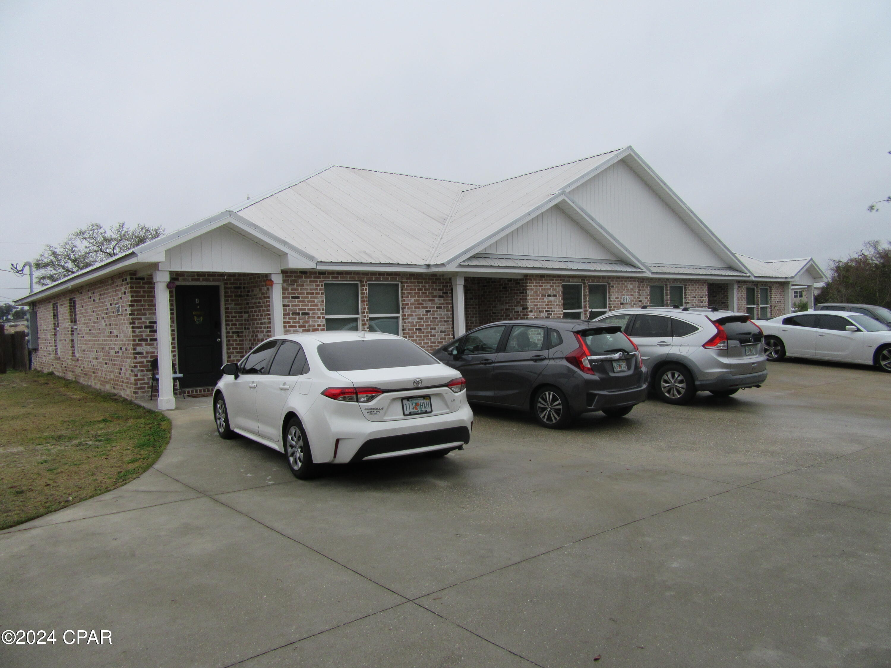 Located in the much desired community of Springfield, this beautiful like new 1 story 3 bedroom 2 bath quadplex is convenient to shopping, dining, schools, and centrally located to the Worlds Most Beautiful Beaches and Military Installations. Improvements include but not limited to new wood plank flooring, paint, trim, upgraded fixtures, and custom cabinets, stainless appliances. Living area is a very large open space, island bar for entertaining. All property sizes and ages are approximate, please measure and/or verify if important. School assignments are subject to change, please check with Bay County for most accurate information. Deposit is the same as the rent. No Pets allowed.