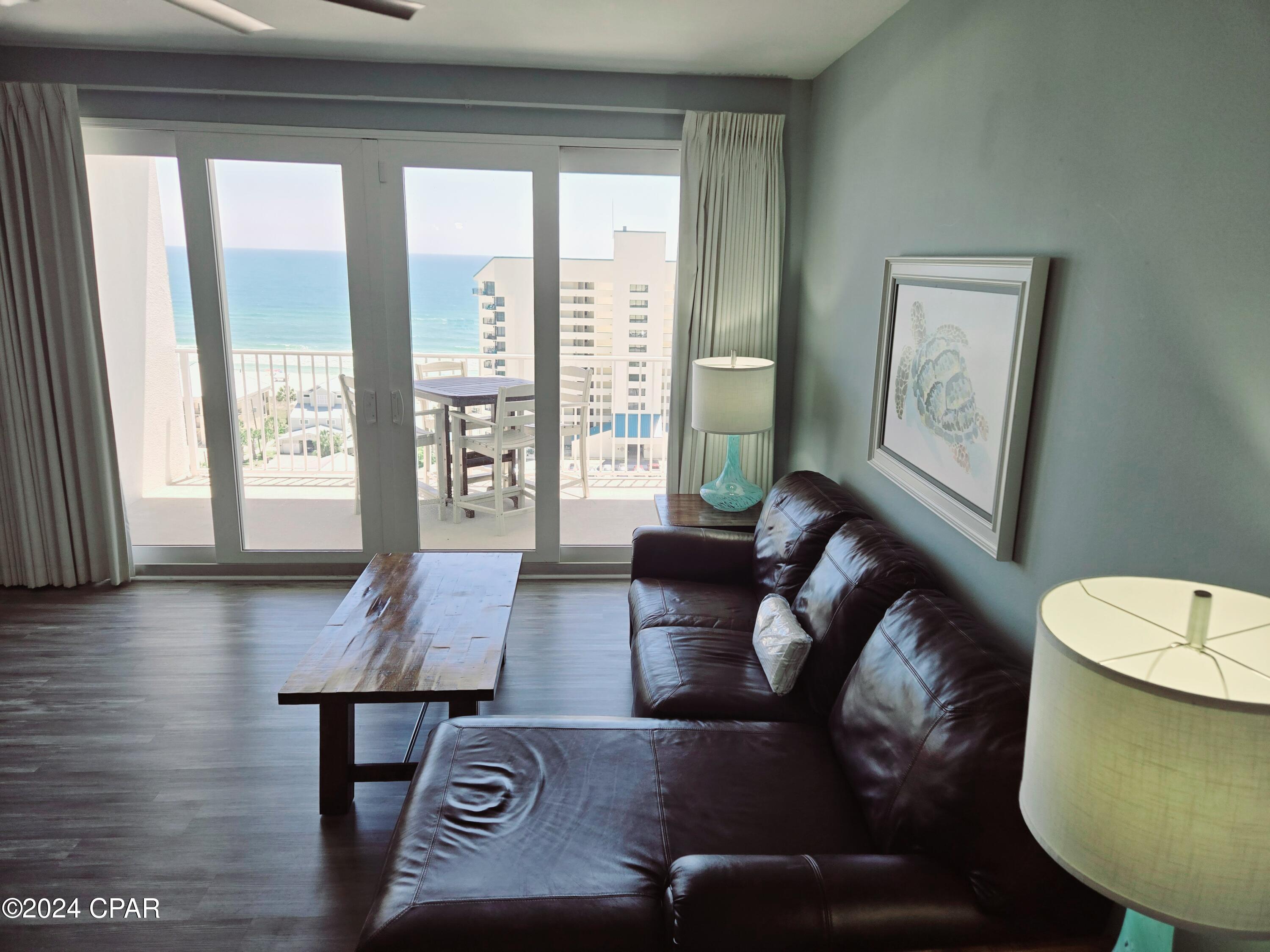 Beautiful GULF VIEW, fully furnished unit at Laketown Wharf across the street from the Gulf for rent! One year lease. This spacious condo has two bedrooms, two bathrooms, and a bunk room. Located on the 11th floor of Laketown Wharf, you will be sure to enjoy the amazing view from the balcony. Enjoy a full kitchen with dishwasher, plus Washer/Dryer in a hall closet. Located near many attractions, restaurants, and water activities with its very own private beach access located directly across the street. Laketown Wharf Resort holds an impressive reputation as one of the largest resorts in PCB. This property is situated along more than 50,000 feet of Lakefront Boardwalk and has a seemingly endless list of amenities to choose from. Resort Amenities: 5 Pools (one is heated), Kiddie Pool, Island Pool, 10th Floor Rooftop Pool, Splash Pool, Zero entry Pool, 2 Hot Tubs, Beach Access, Fitness Center fully equipped, Putting Green, Nightly fountain and light show, Eateries in Laketown Wharf (Juan Taco, Lulu's, The Wharf Seafood Buffet, Pizza, Sandwich Shop, and Candymaker Ice Cream Shop), On-site Security, WIFI Nearby Attractions: Pineapple Willy's across the street, Walmart across the street. Enjoy being steps away from the beautiful white sand, emerald waters of the Gulf and amazing sunsets on the beach.