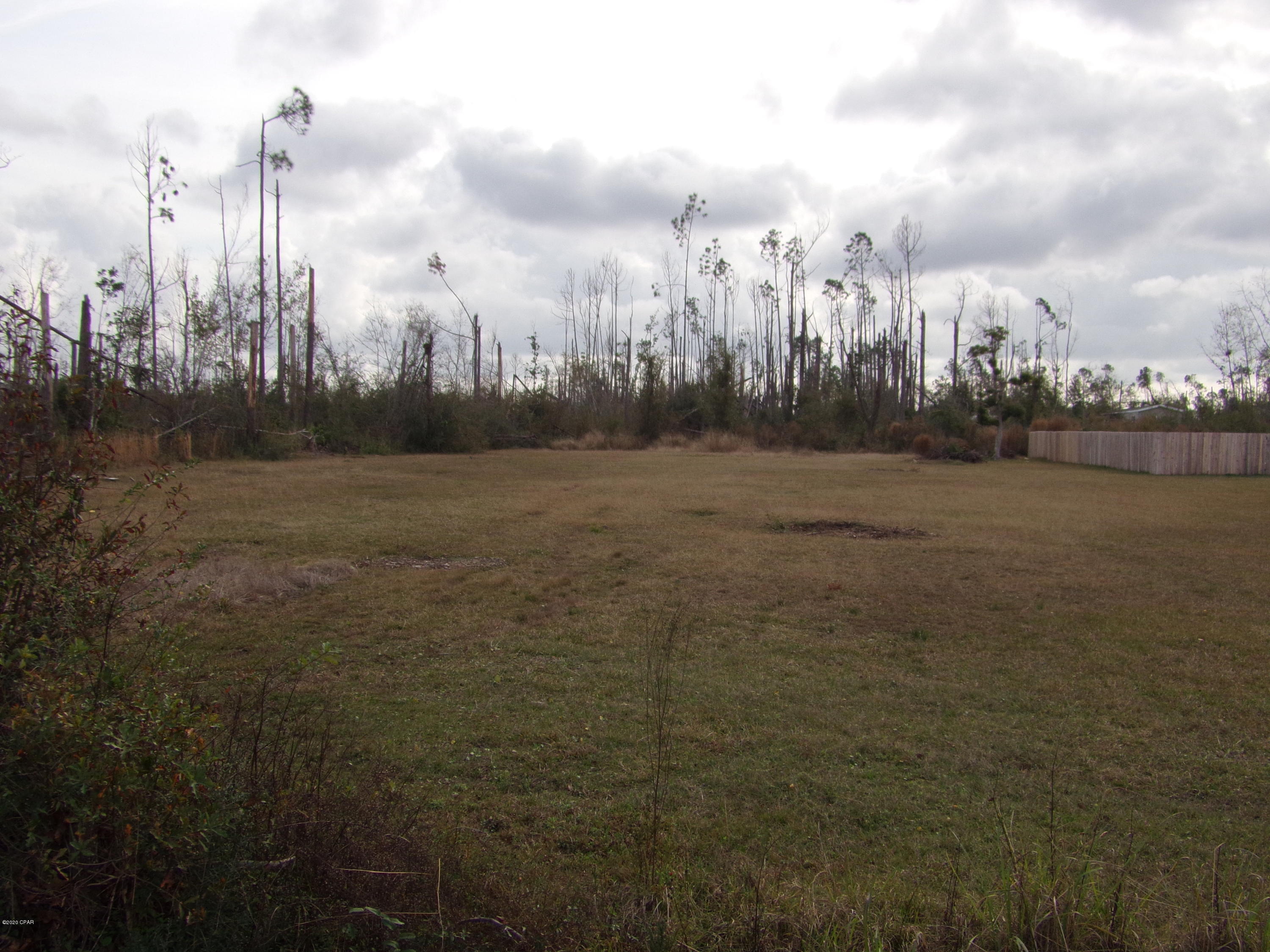 Large cleared lot on almost an acre. Zoned R-2  for residential single family or duplex. City water  and sewer available. High and dry close to schools, Tyndall Air Force Base H.G Harder's park and walking track.  All this lot is missing is you and your home.