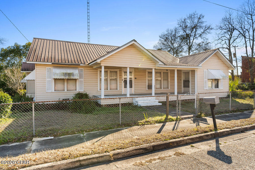 Great Investment Opportunity in the heart of Graceville! Located at 987 7th Avenue, this charming 3-bedroom, 3-bath home, originally built in 1945, offers character, space, and plenty of potential. Situated in town for convenient access to local amenities, the property features a 2-car carport and a flexible floor plan that includes an additional living space which could easily be converted into a fourth bedroom, home office, or bonus room. With some TLC and vision, this historic home could be restored to its former glory and transformed into a wonderful residence or income-producing investment. Whether you're looking to renovate, rent, or personalize, this property presents a great opportunity to bring new life to a classic Graceville home.

CASH ONLY!