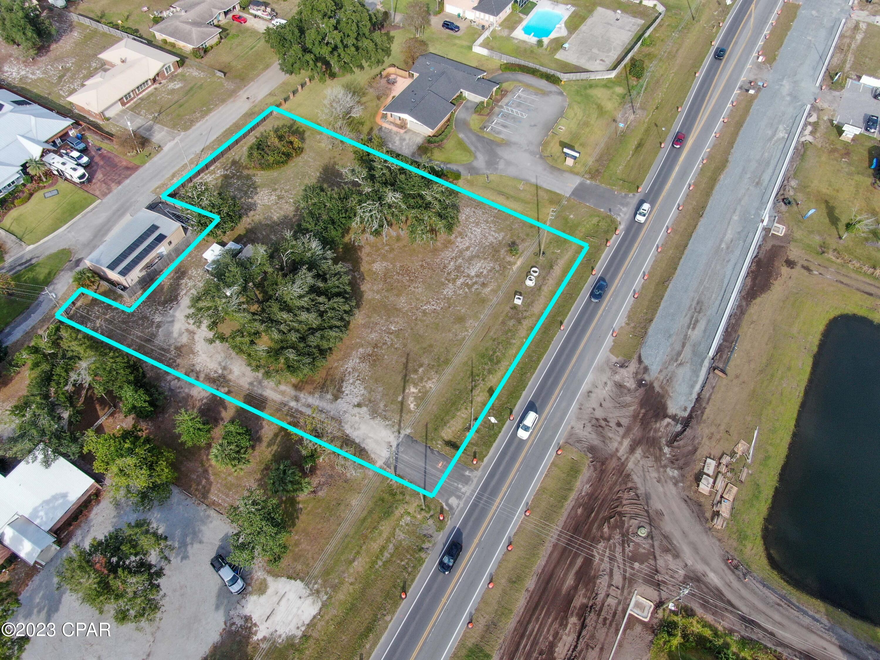 High, Dry and cleared, this is truly a rare find in our market. This beautiful 1.2 +/- acre parcel is ready for development and affordably priced for a future medical/business office, QSR or retail store. Fence on north border of parcel conveys with purchase, features 'double gate' providing access to Pretty Bayou Island Dr.